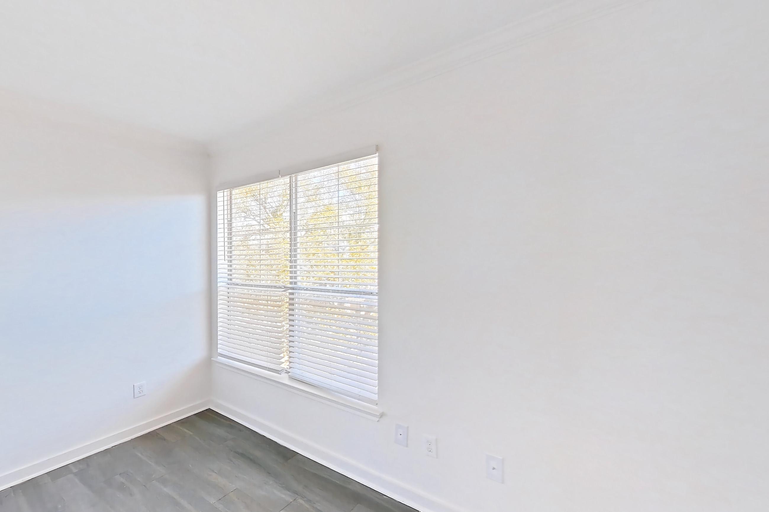 Living room with dark wood-finish flooring, Apartment 02831 at Cortland West Plano