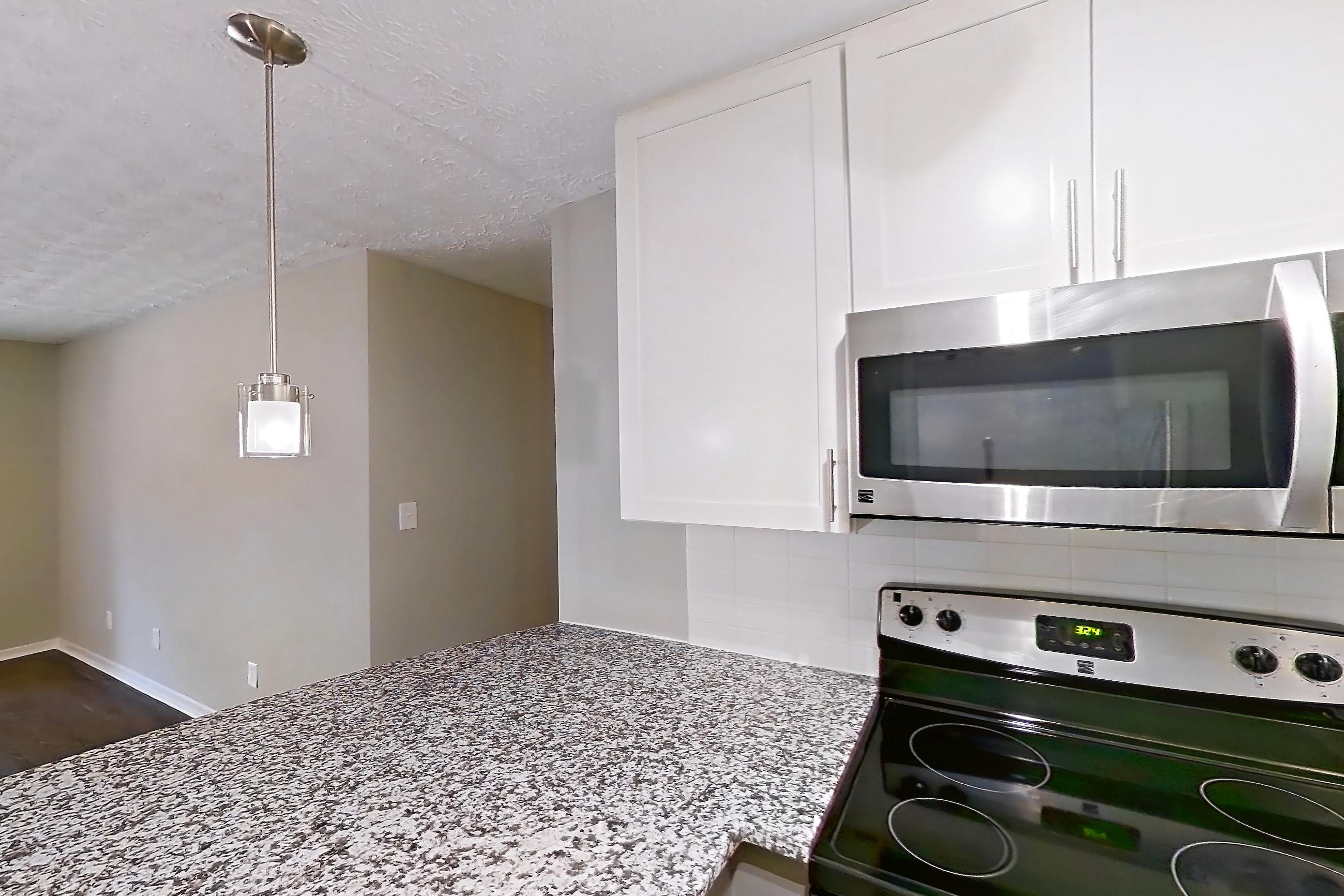 Kitchen in Apartment 2039s at Cortland at the Village, B1aR - The Reece A floor plan