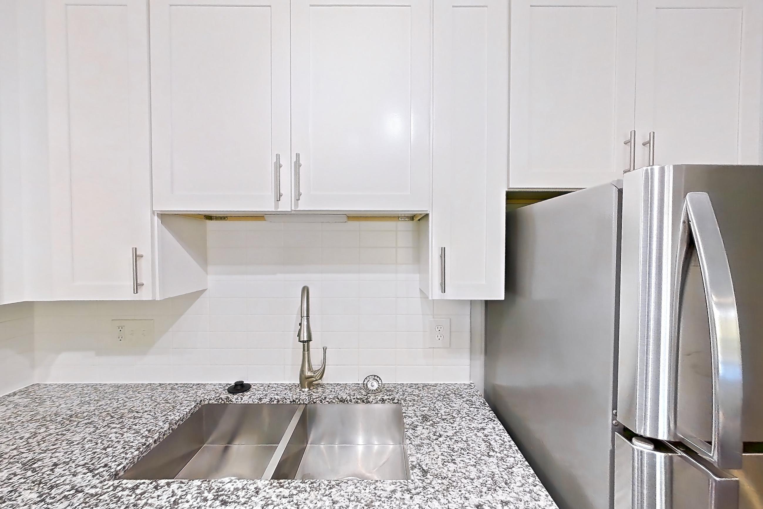 Kitchen in Apartment 2039s at Cortland at the Village, B1aR - The Reece A floor plan