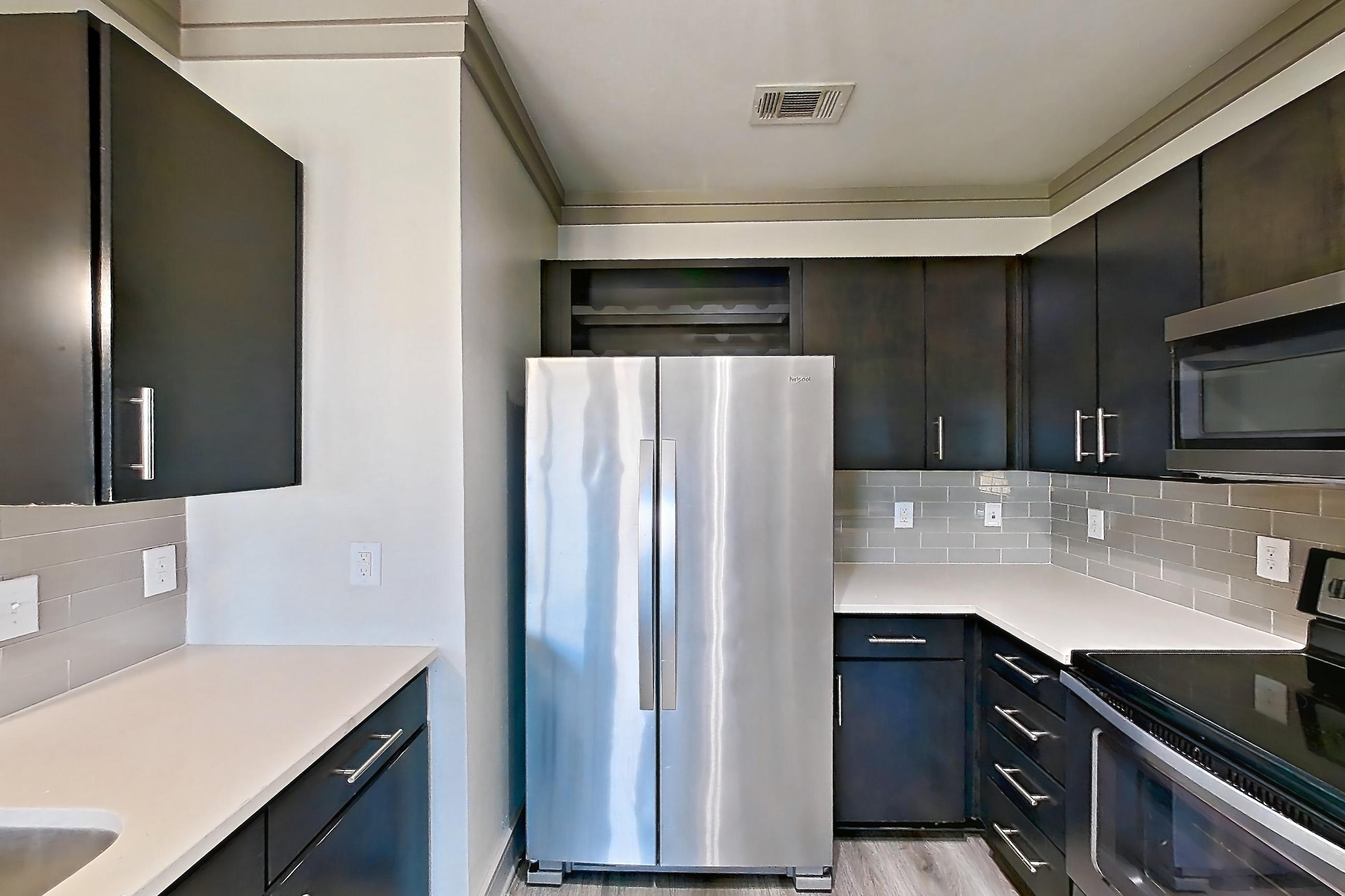 Kitchen in Apartment 18211 at Cortland Phillips Creek Ranch, B1 floor plan