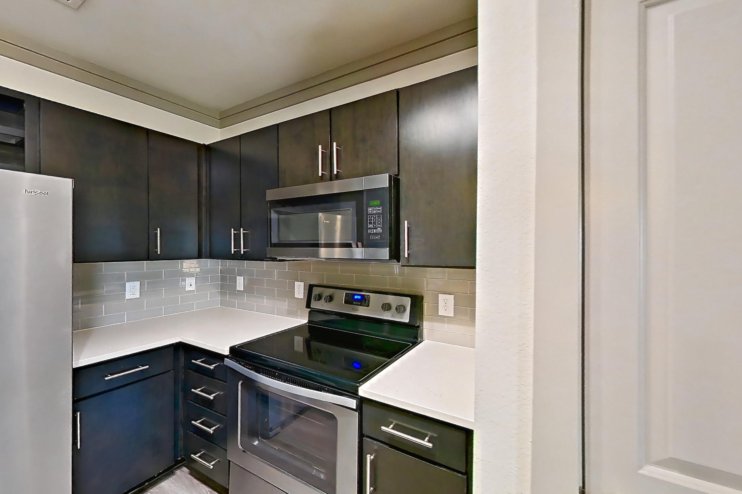 Kitchen in Apartment 18211 at Cortland Phillips Creek Ranch, B1 floor plan