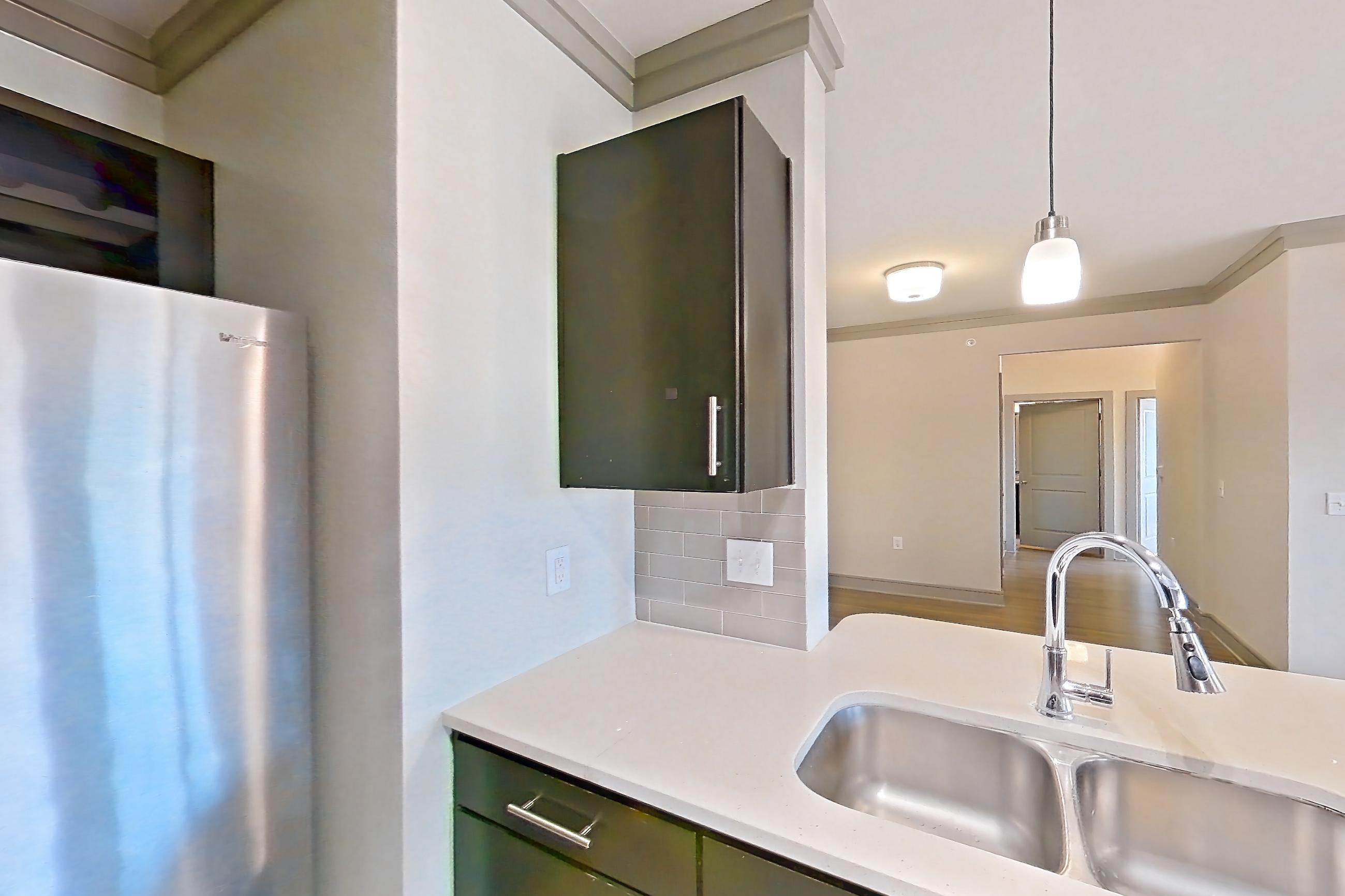 Kitchen in Apartment 11302 at Cortland Phillips Creek Ranch, C1 floor plan