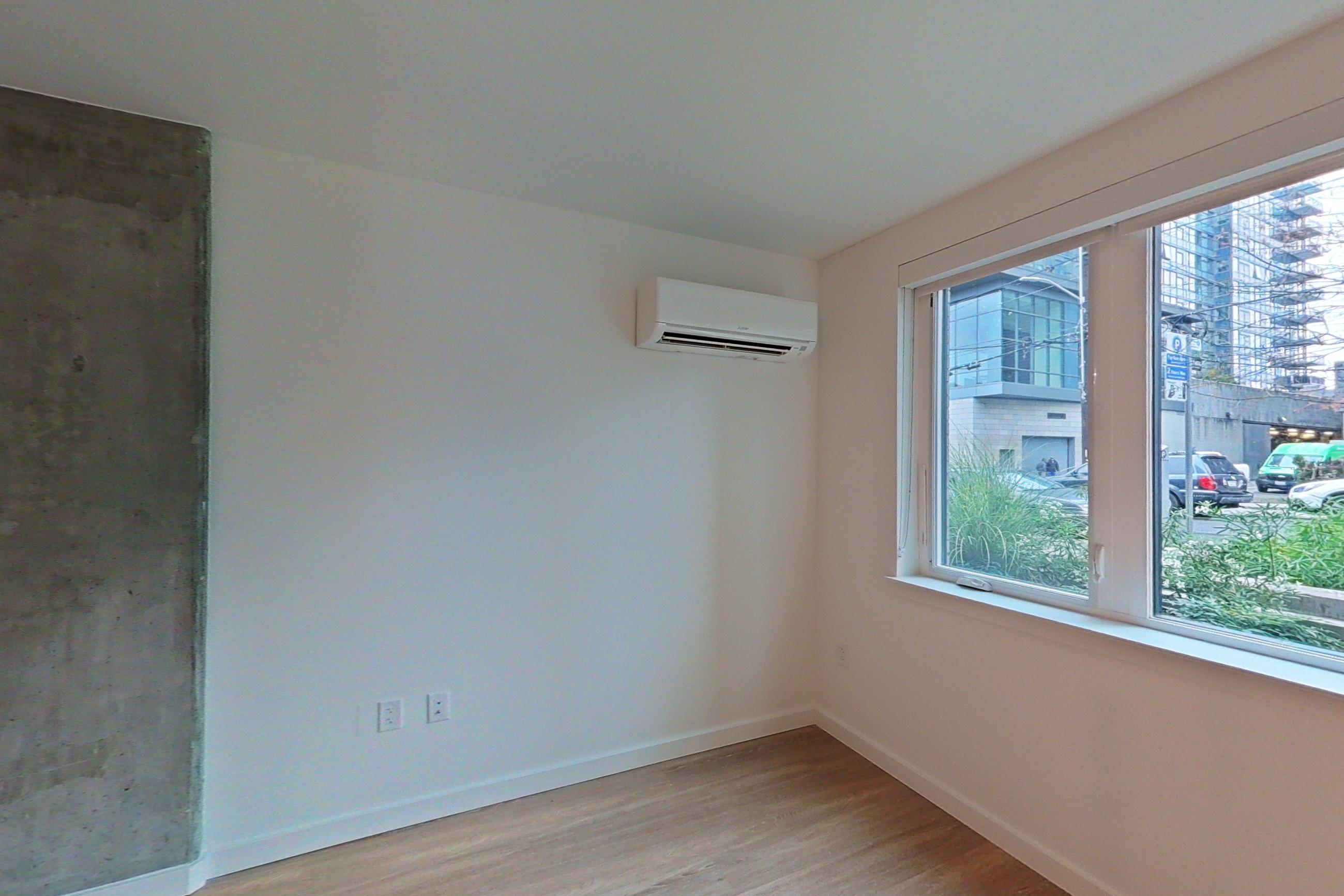 Living space with mini-split AC, Apartment 125 at The Victor