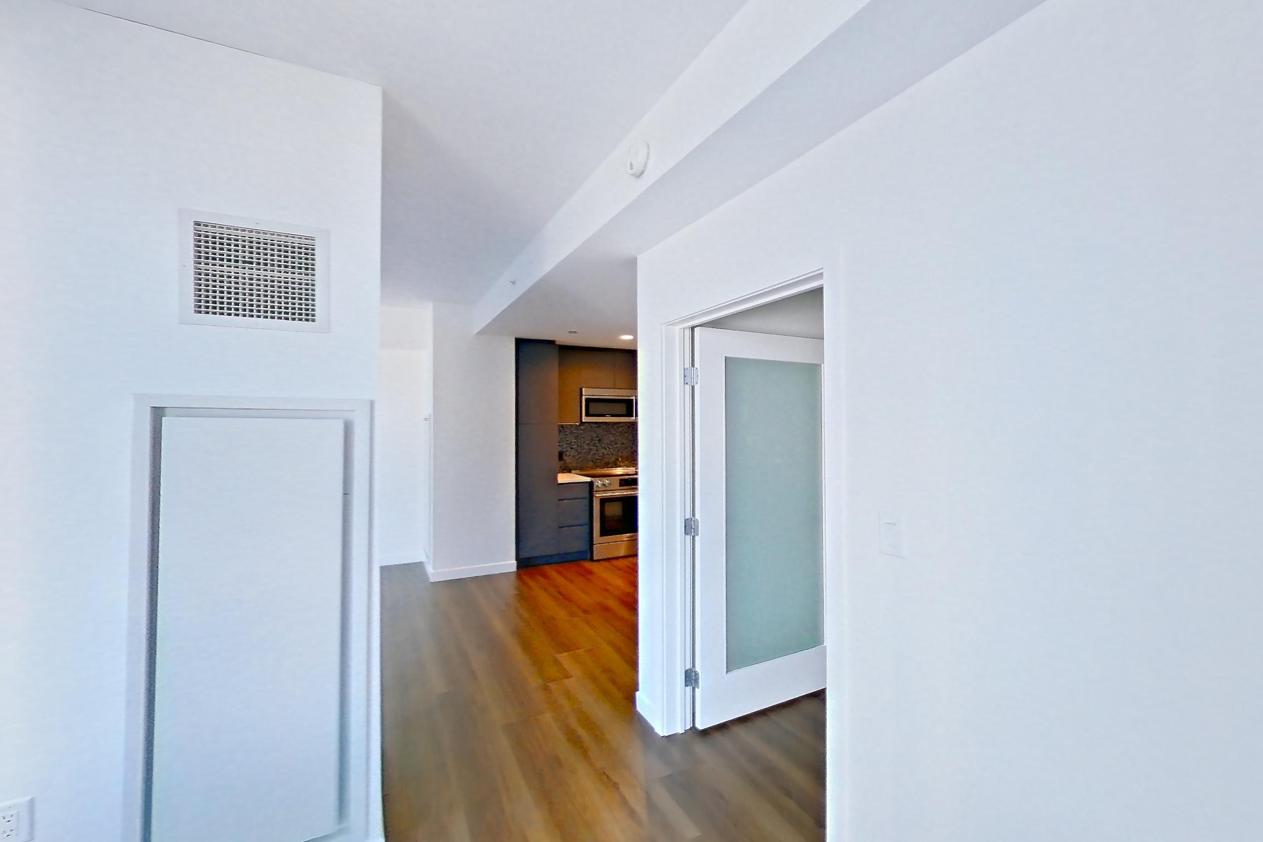 Living space in Apartment 1501 at The Sudbury, AD6 | 1 Bed | 1 Bath | Den floor plan