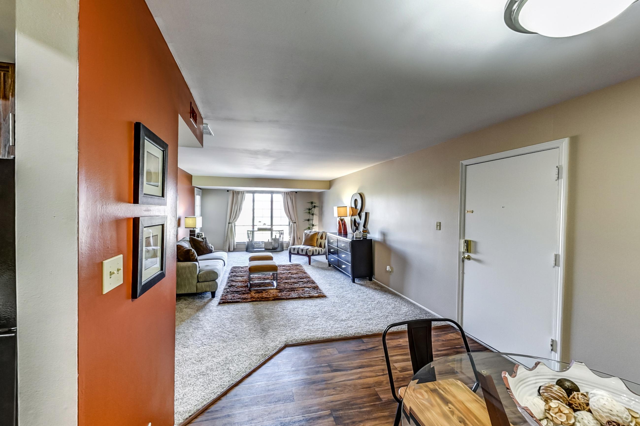 Dining room with black appliances, electric range, light countertops, oven/range, and refrigerator, Apartment Model 4 at Canterbury Green