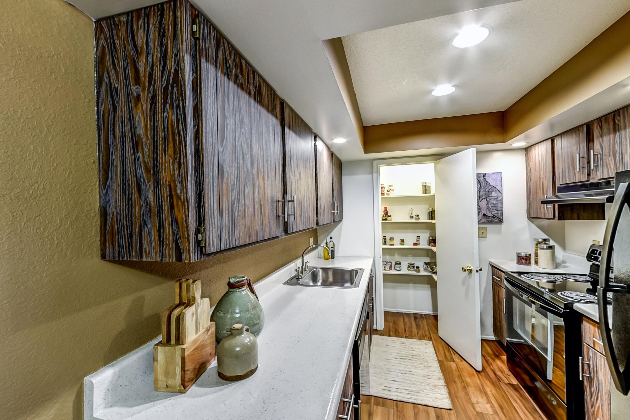 Dining room with black appliances, electric range, light countertops, oven/range, and refrigerator, Apartment Model 4 at Canterbury Green