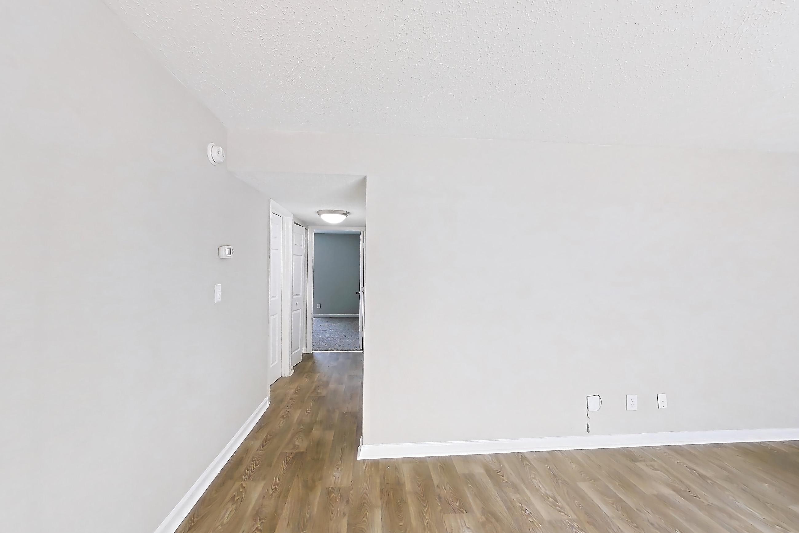Living room with parquet flooring, Apartment H1527D at The Legacy at Druid Hills