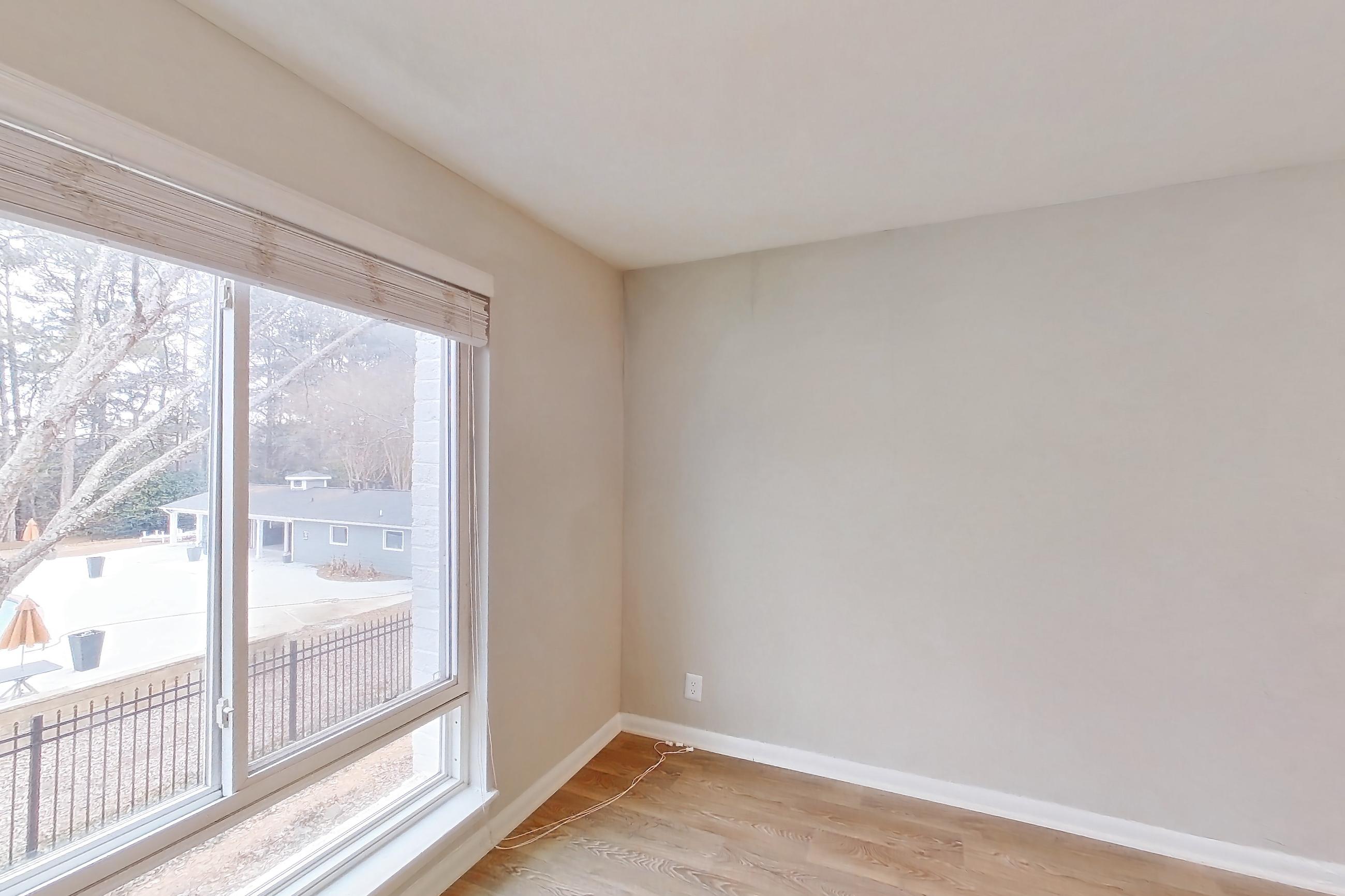 Dining room with light wood-finish flooring, Apartment H1544D at The Legacy at Druid Hills