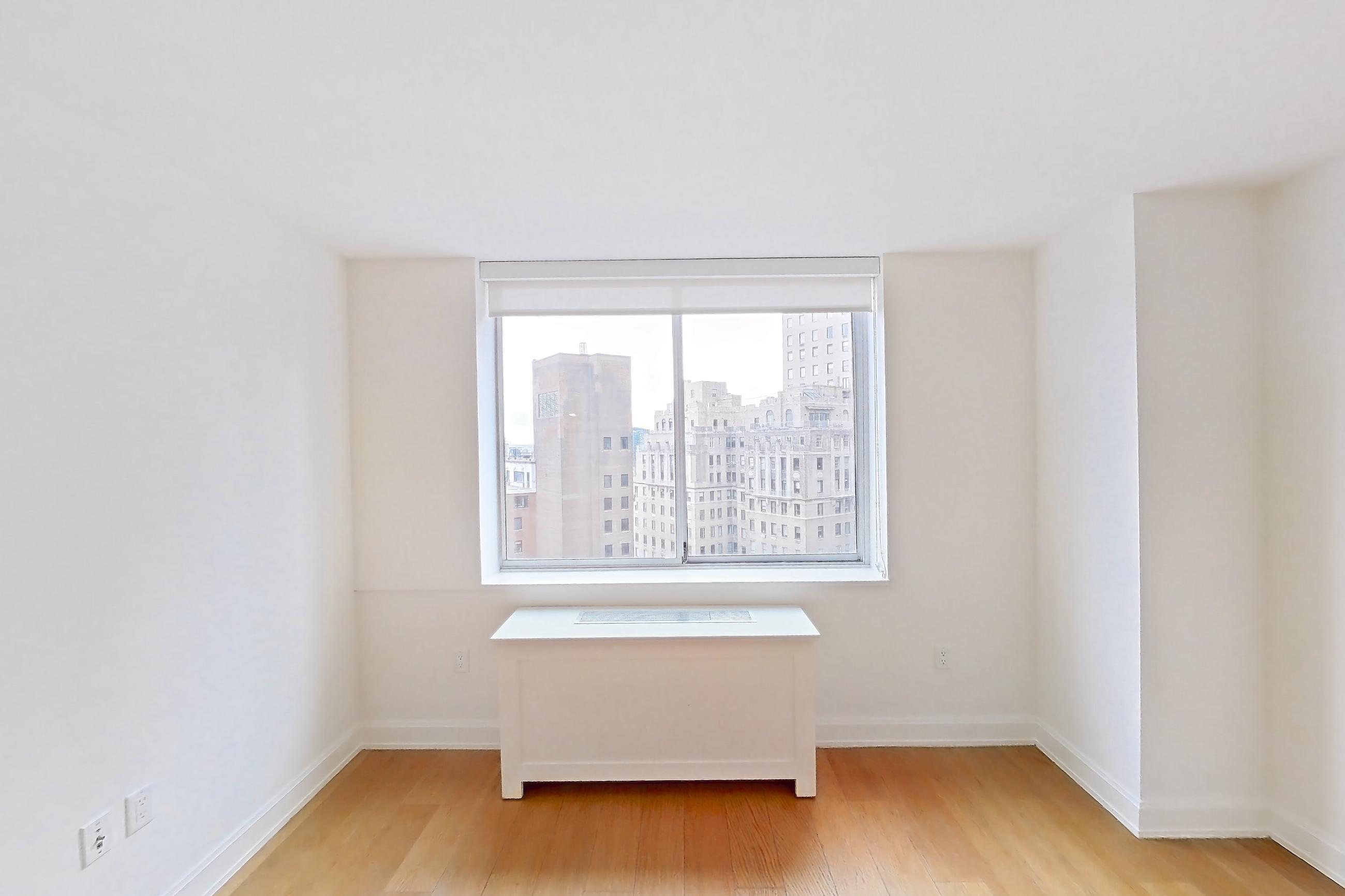 Living space with city view, light wood-finish flooring, and skyline view, Apartment 1913 at Oriana