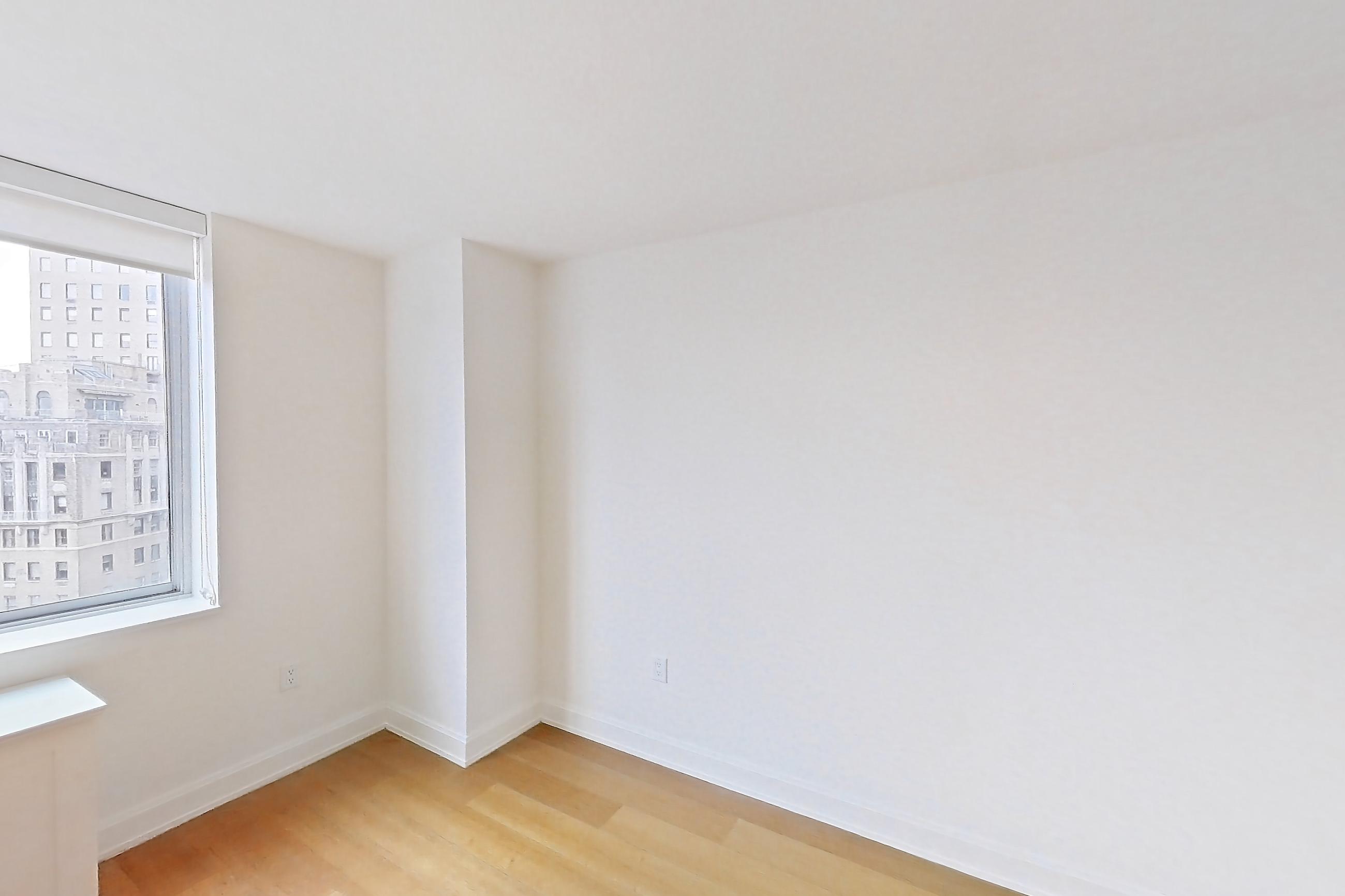 Living space with city view, light wood-finish flooring, and skyline view, Apartment 1913 at Oriana