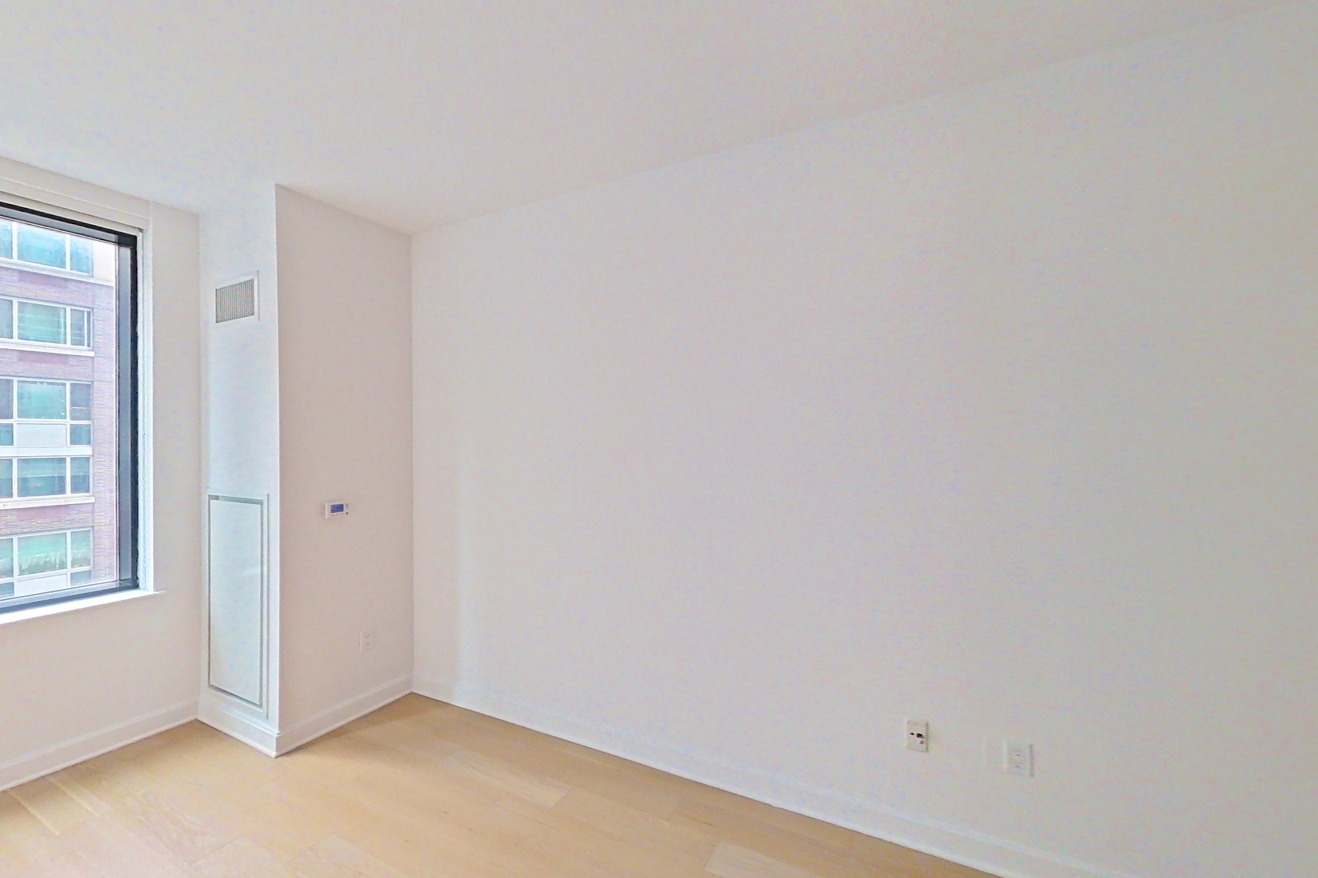 Living space with light wood-finish flooring, Apartment 1316 at 21 West End Avenue
