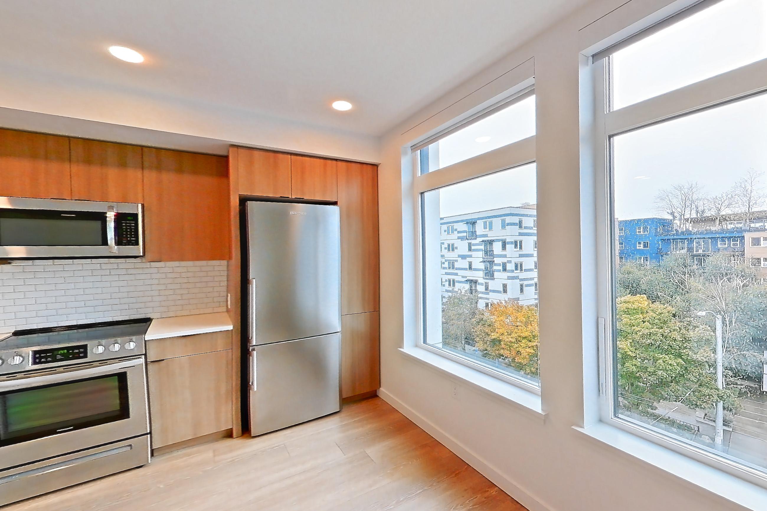 Living room, Apartment 703 at Ballard Yards