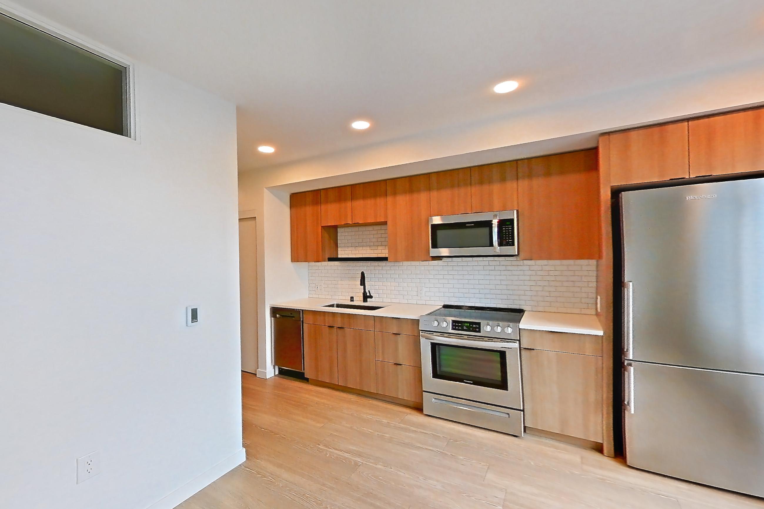 Living room, Apartment 703 at Ballard Yards