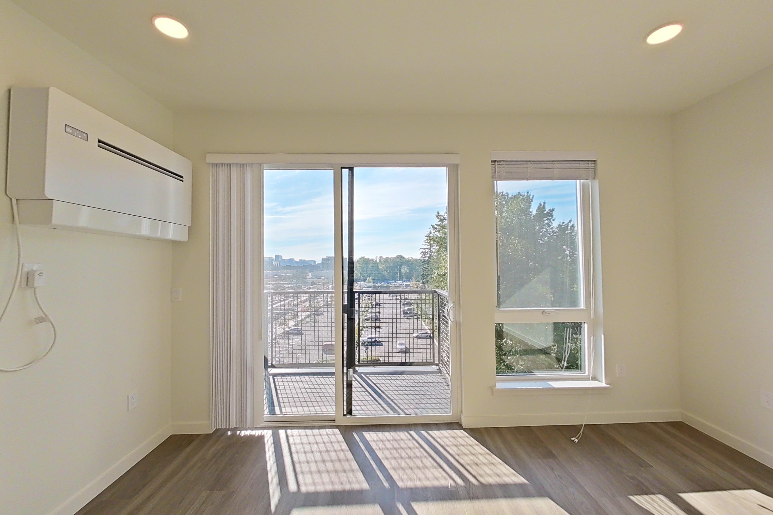 Living space with dark wood-finish flooring, Apartment 722 at Ondina Apartments