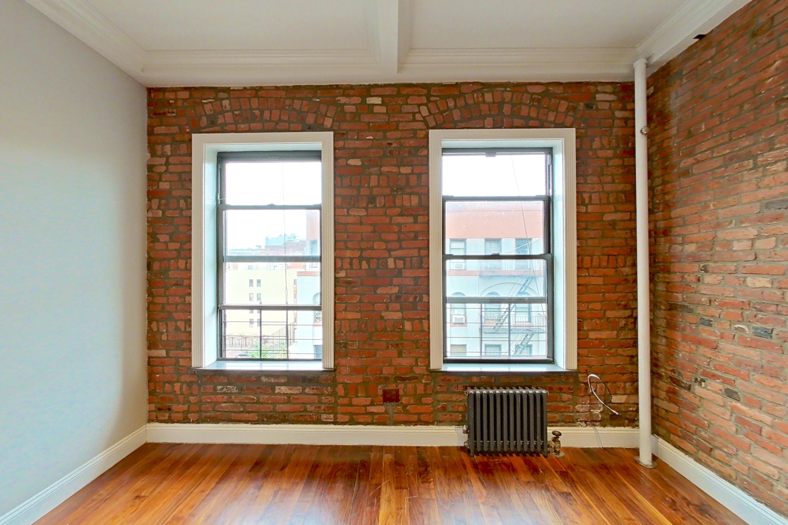 Living space with radiator heat, Apartment 9 at Centennial Properties