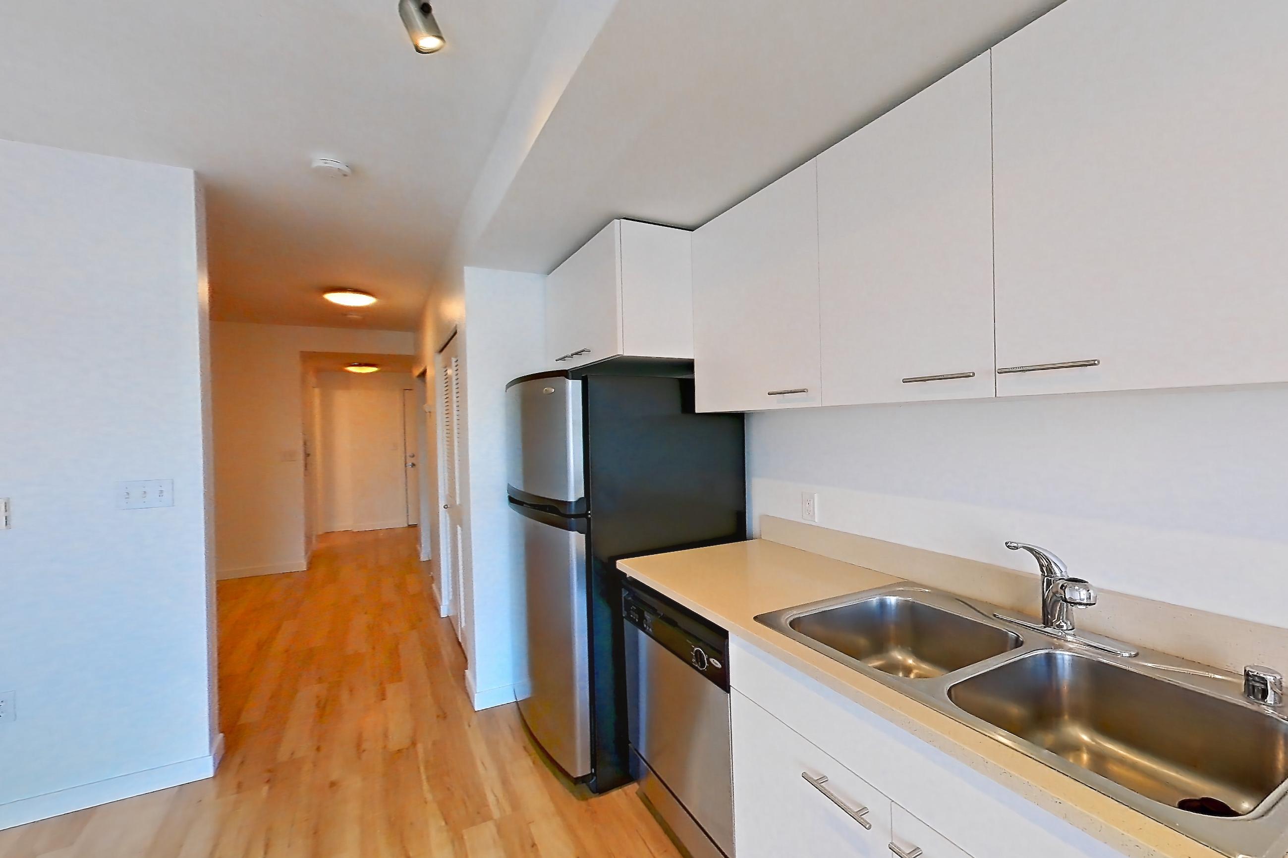 Kitchen in a Open 1 Bedroom 1 Bath A22.1 floor plan apartment, representative of Apartment 0237 at Circa Greenlake