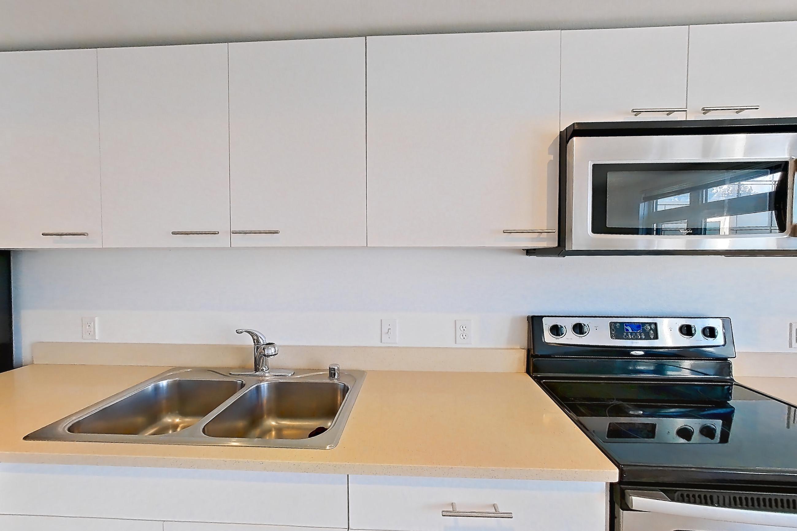 Kitchen in a Open 1 Bedroom 1 Bath A22.1 floor plan apartment, representative of Apartment 0237 at Circa Greenlake