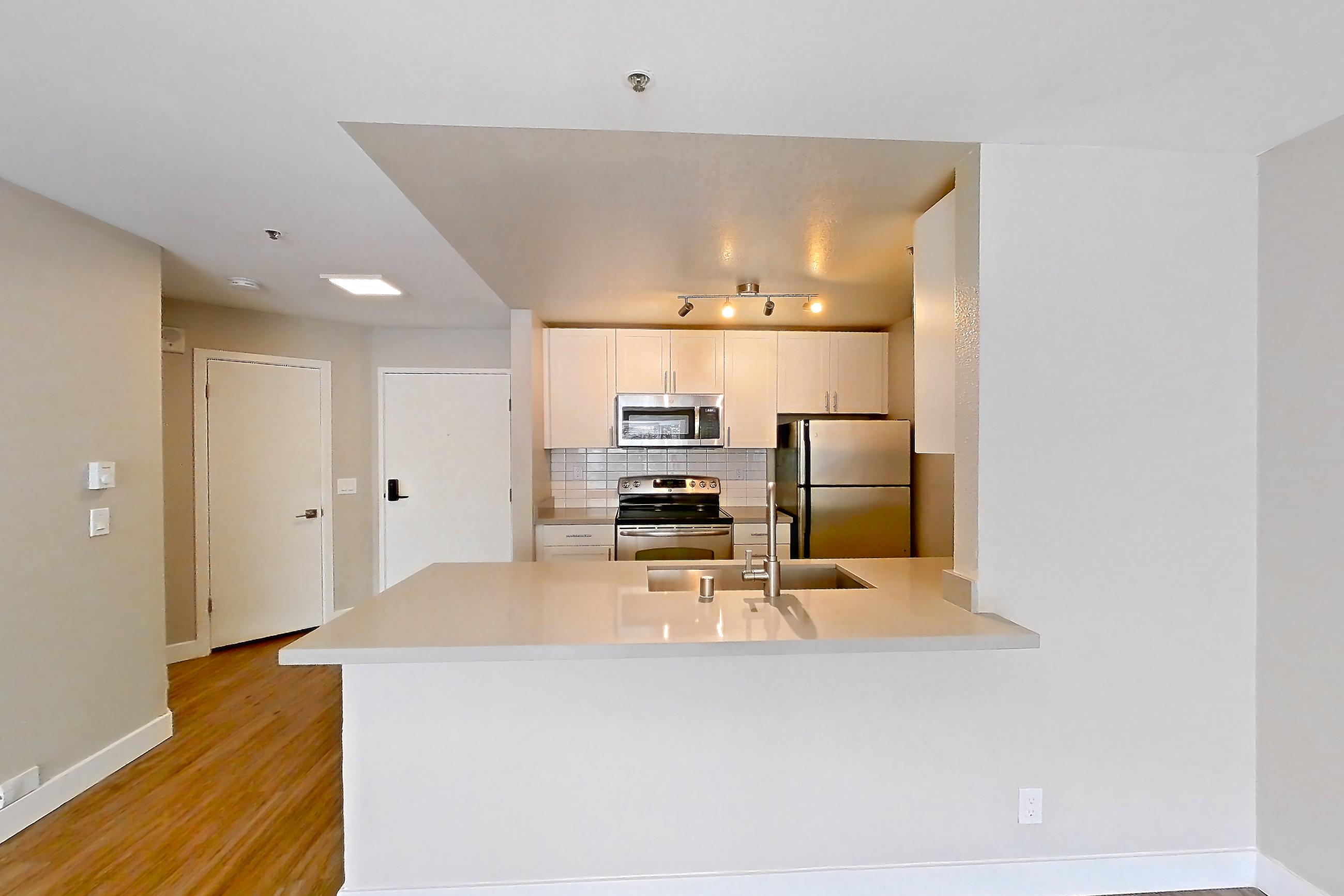 Dining room in Apartment 4-203 at Bayside Village, 1J floor plan