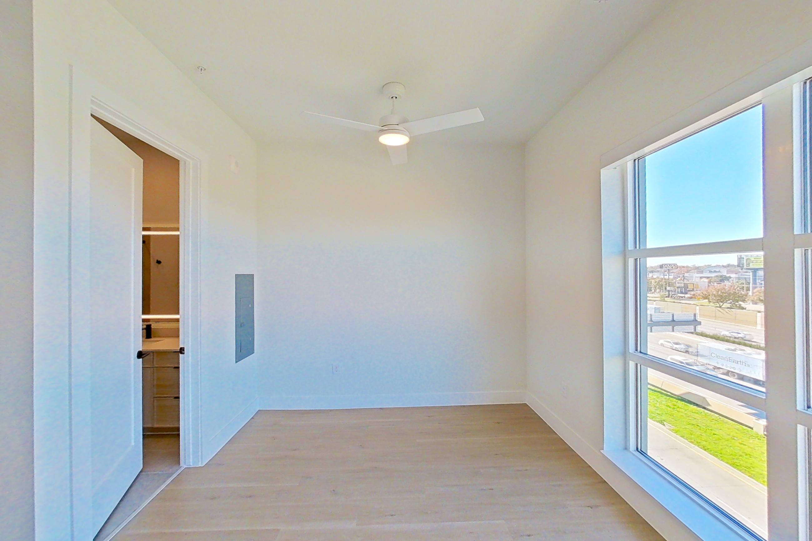 Living space with light wood-finish flooring, Apartment 514 at Lantower Midtown