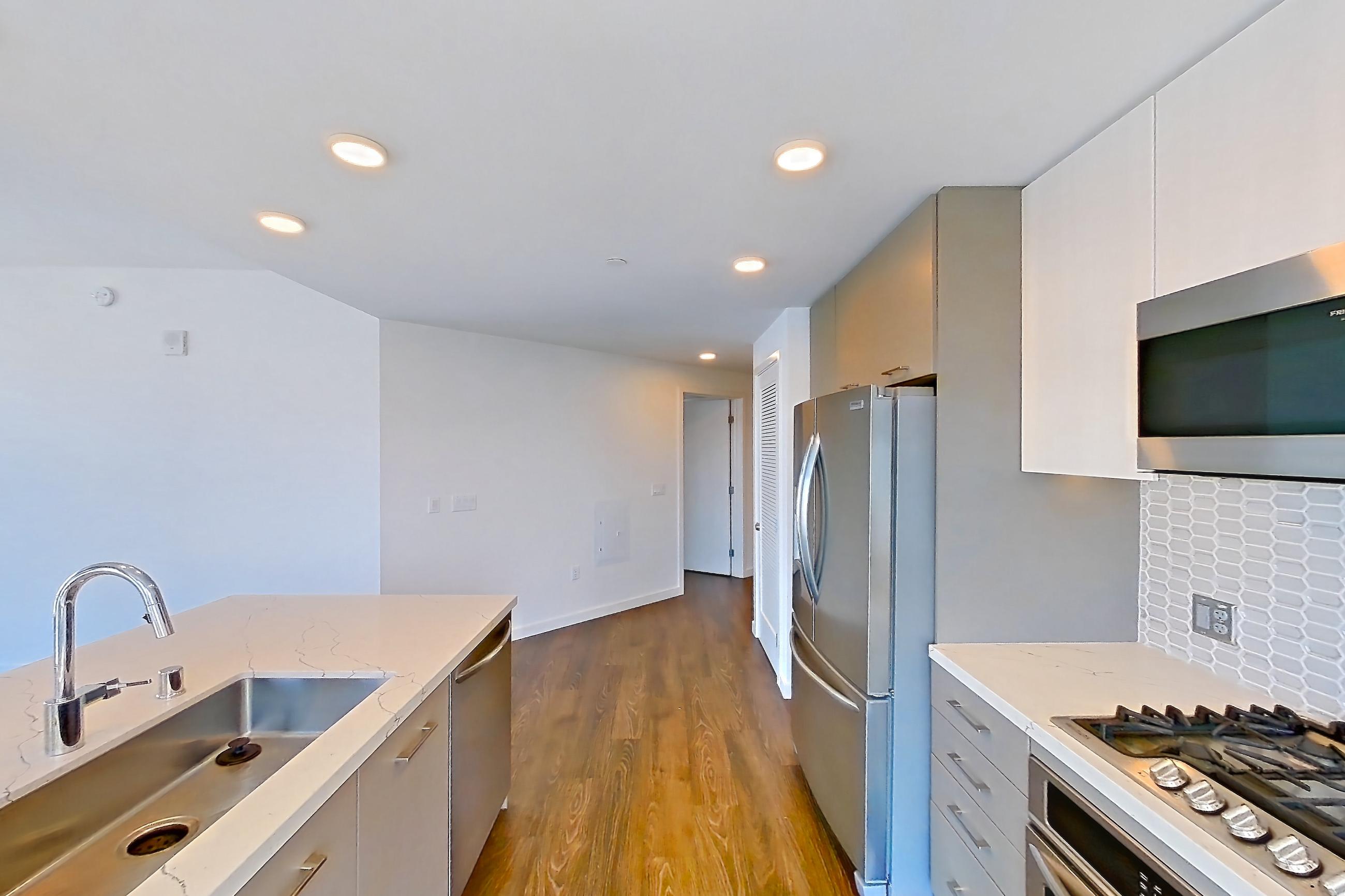 Kitchen in Apartment 0-1012 at Merian, 2M floor plan