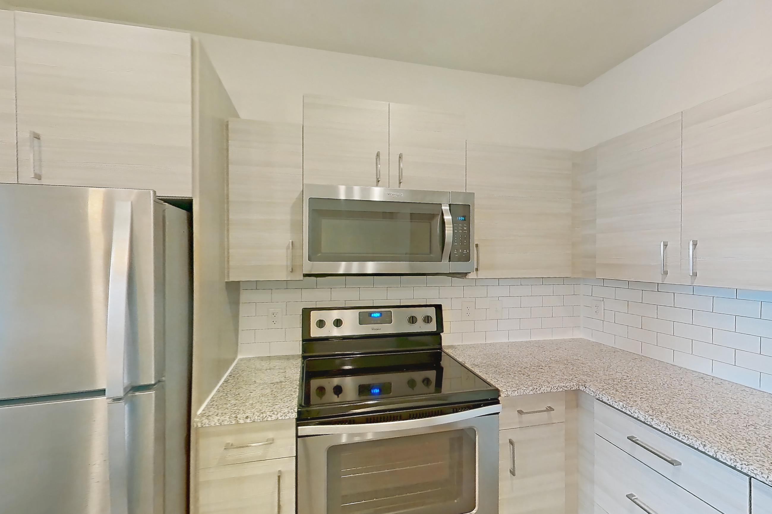 Kitchen in Apartment 104-304 at Domain, 2A floor plan