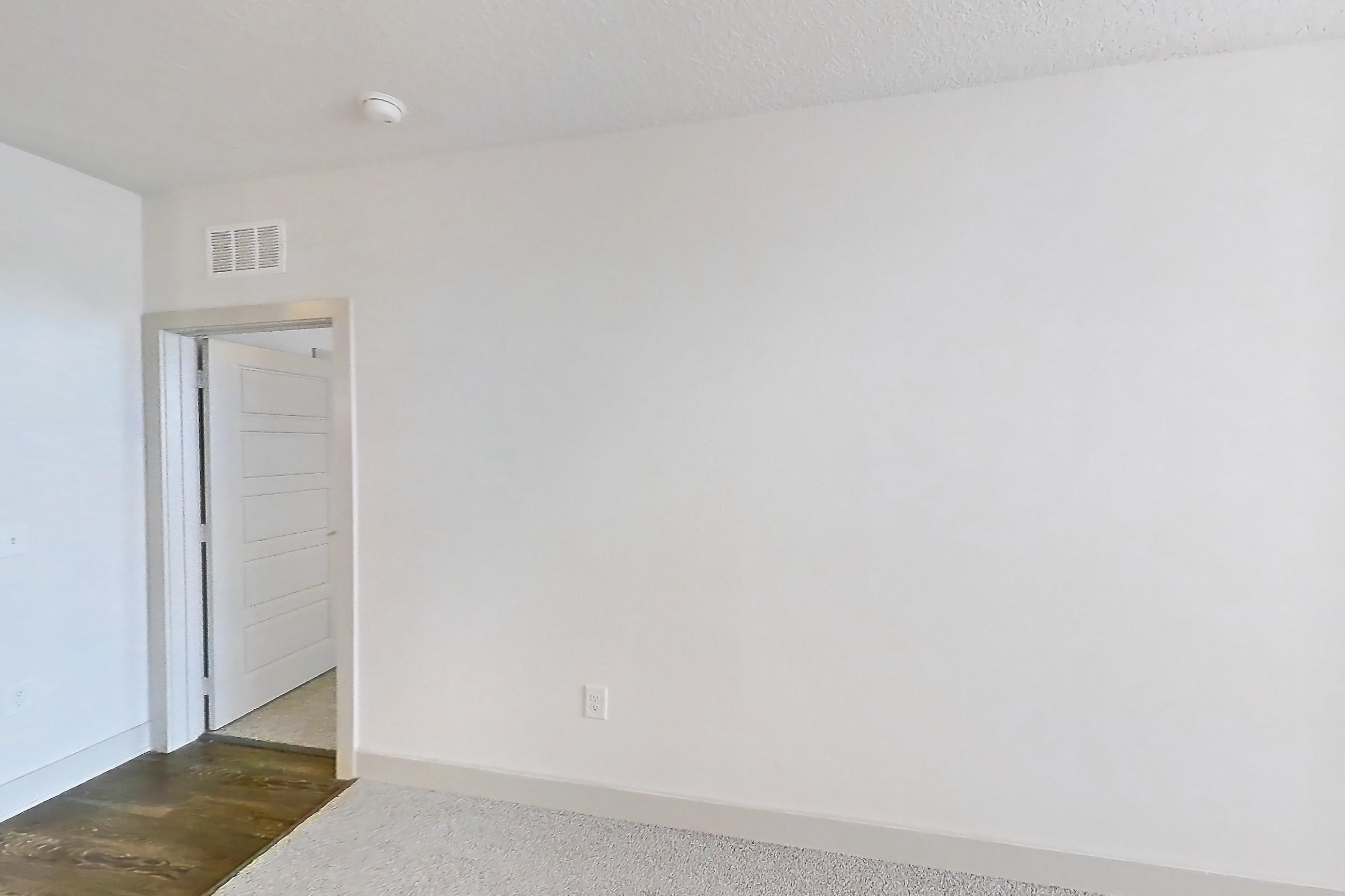 Living room with cooktop, light carpet, refrigerator, stainless steel appliances, and white appliances, Apartment 144-202 at Domain