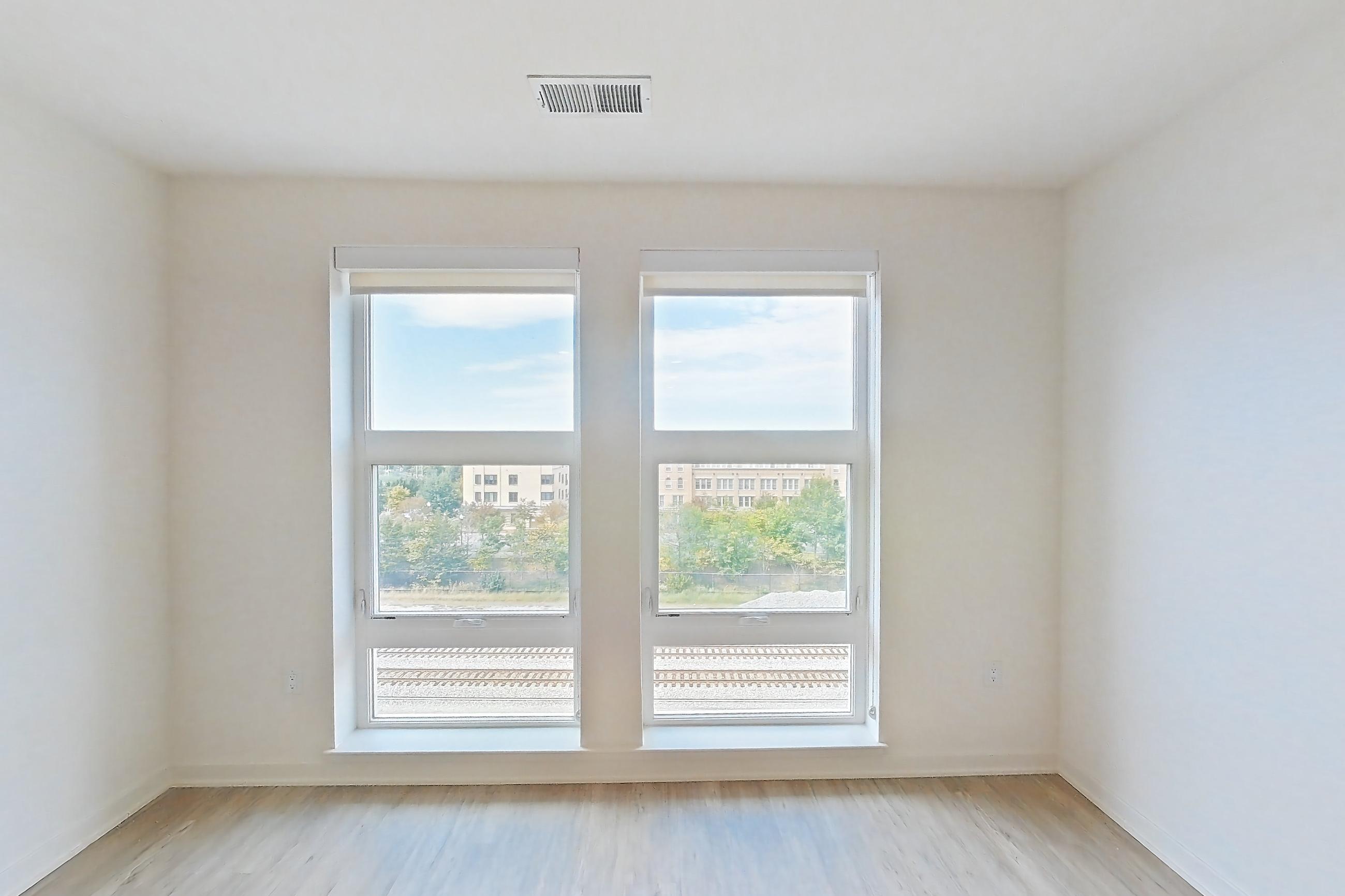 Living room with light wood-finish flooring, Apartment 2507 at Platform (VA)
