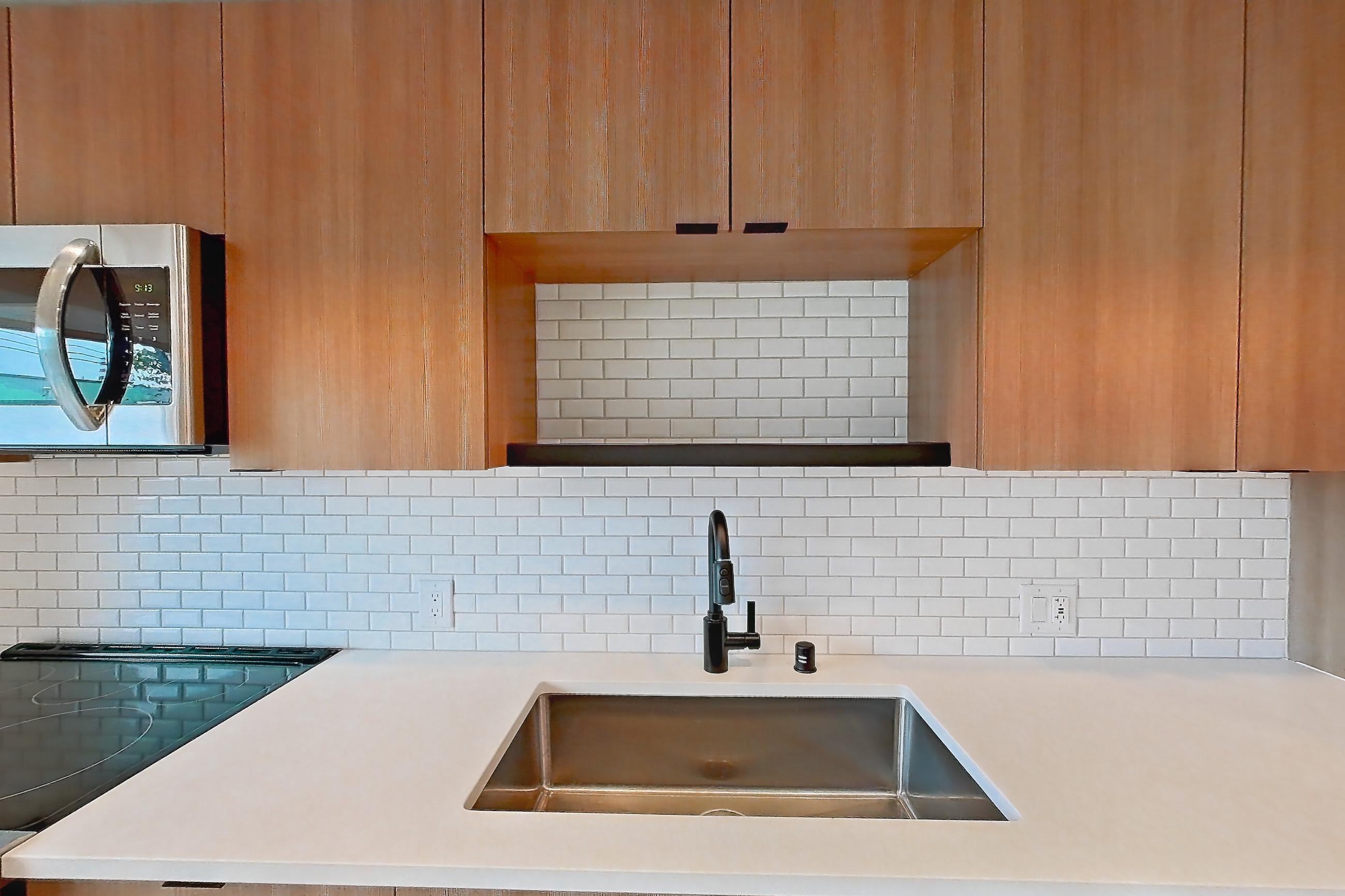Kitchen in Apartment 122 at Ballard Yards, A5A floor plan