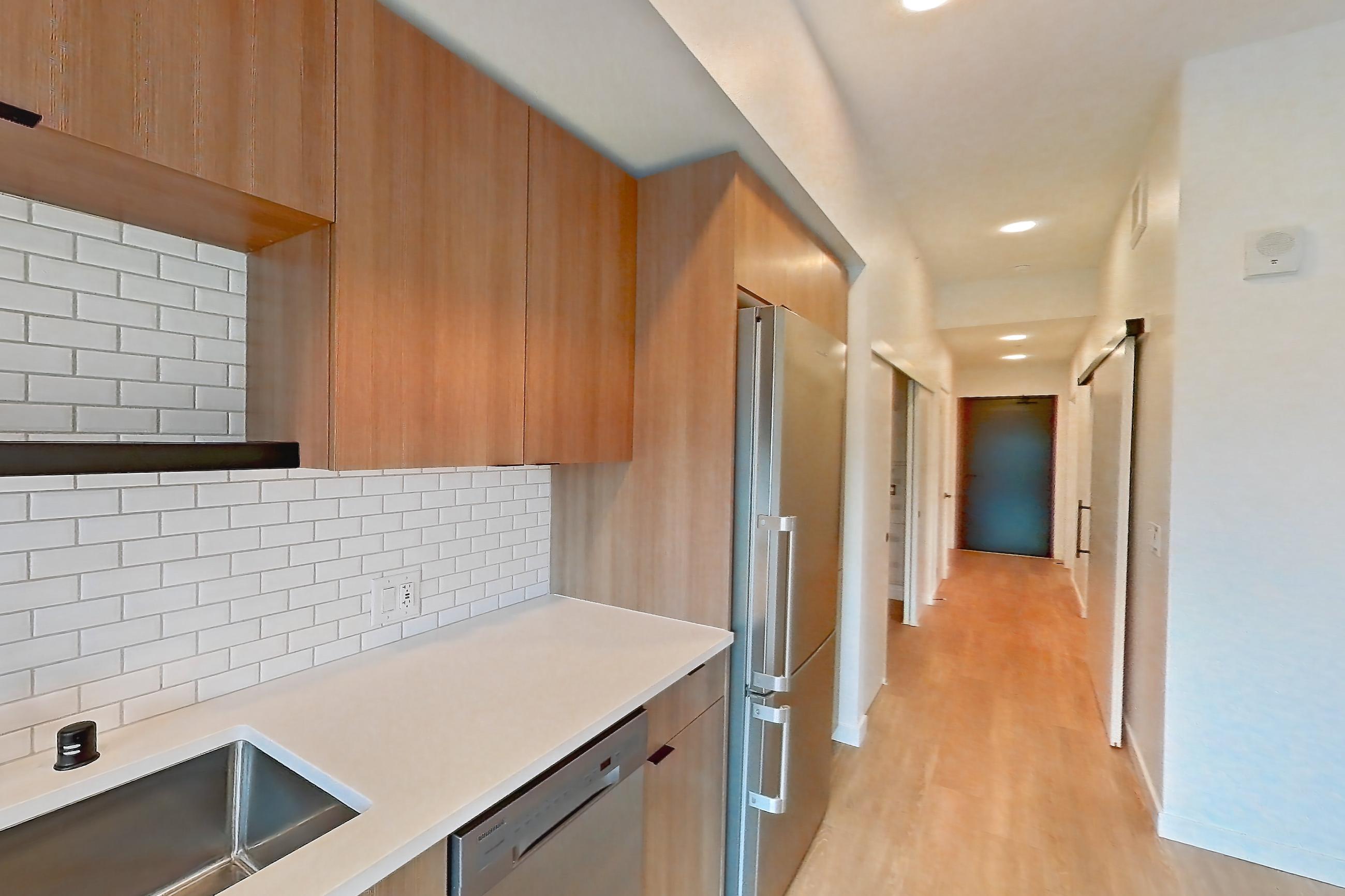 Kitchen in Apartment 122 at Ballard Yards, A5A floor plan