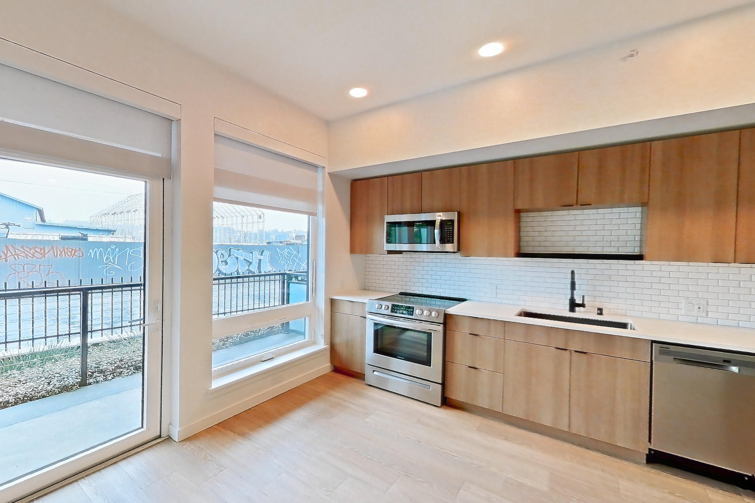 Living room, Apartment 122 at Ballard Yards