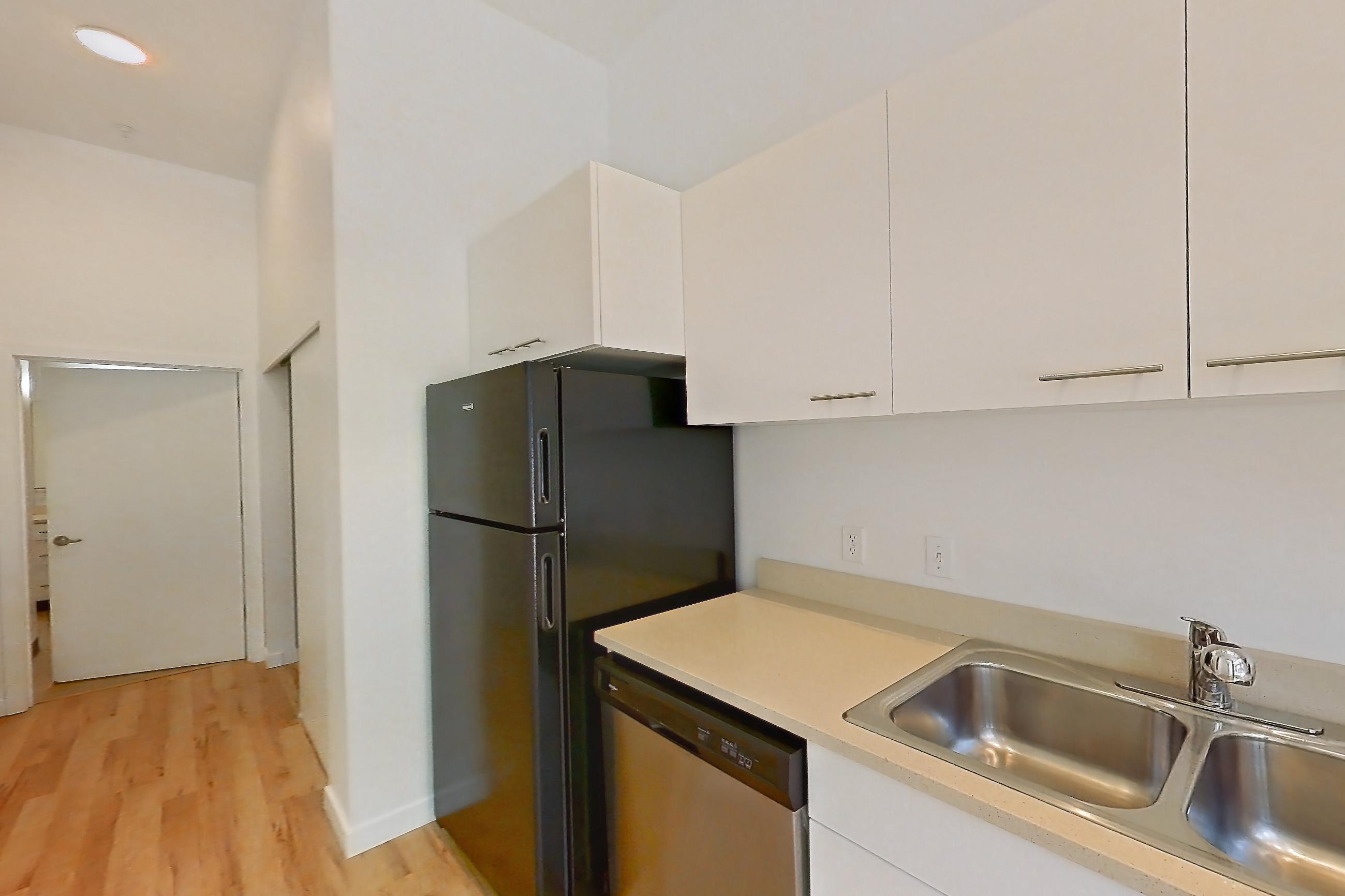 Kitchen in a 1 Bedroom 1 Bath - A1.1 floor plan apartment, representative of Apartment 0112 at Circa Greenlake