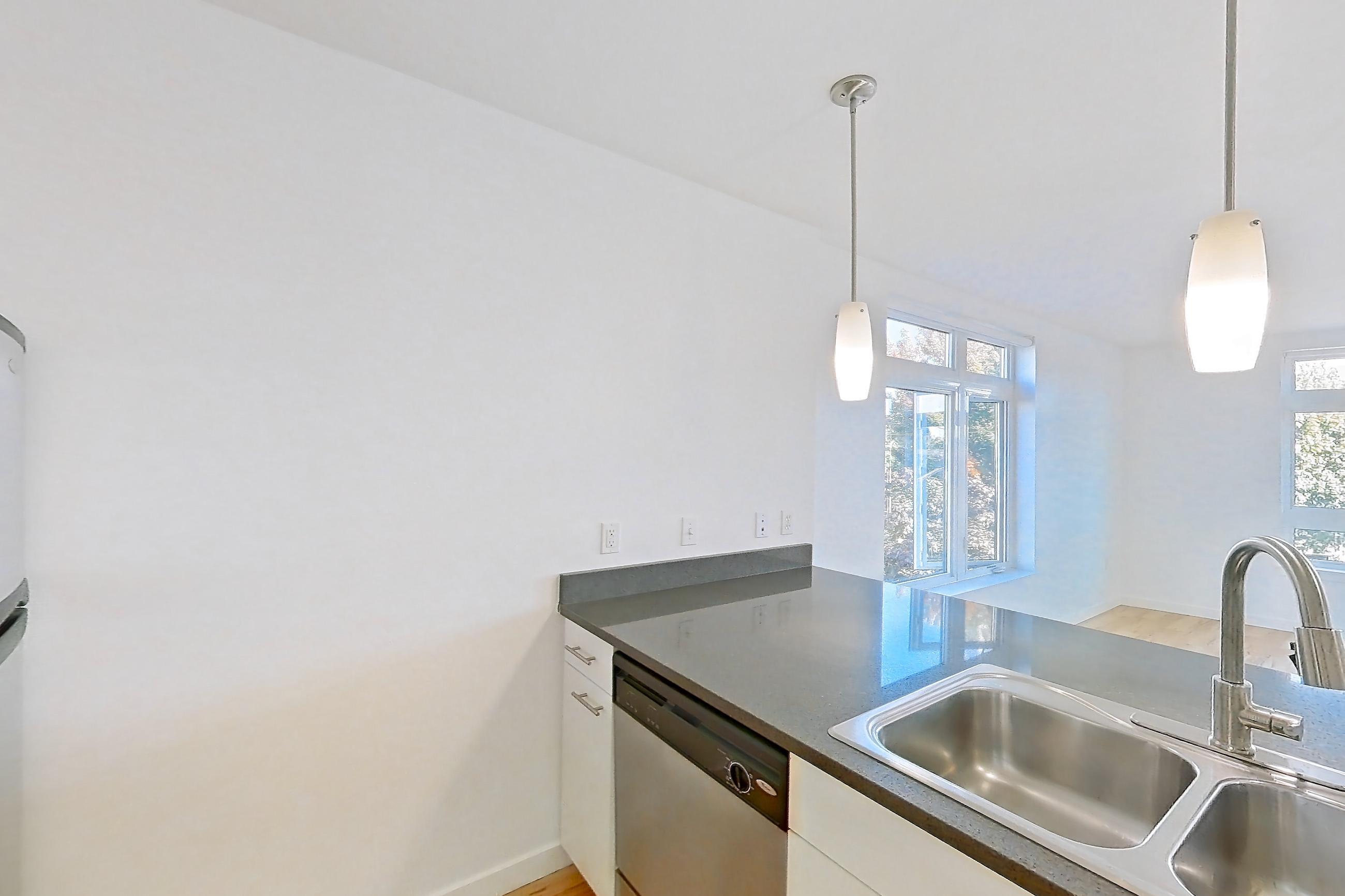 Kitchen in a 2 Bedroom 2 Bath - B4.2 floor plan apartment, representative of Apartment 0420 at Circa Greenlake