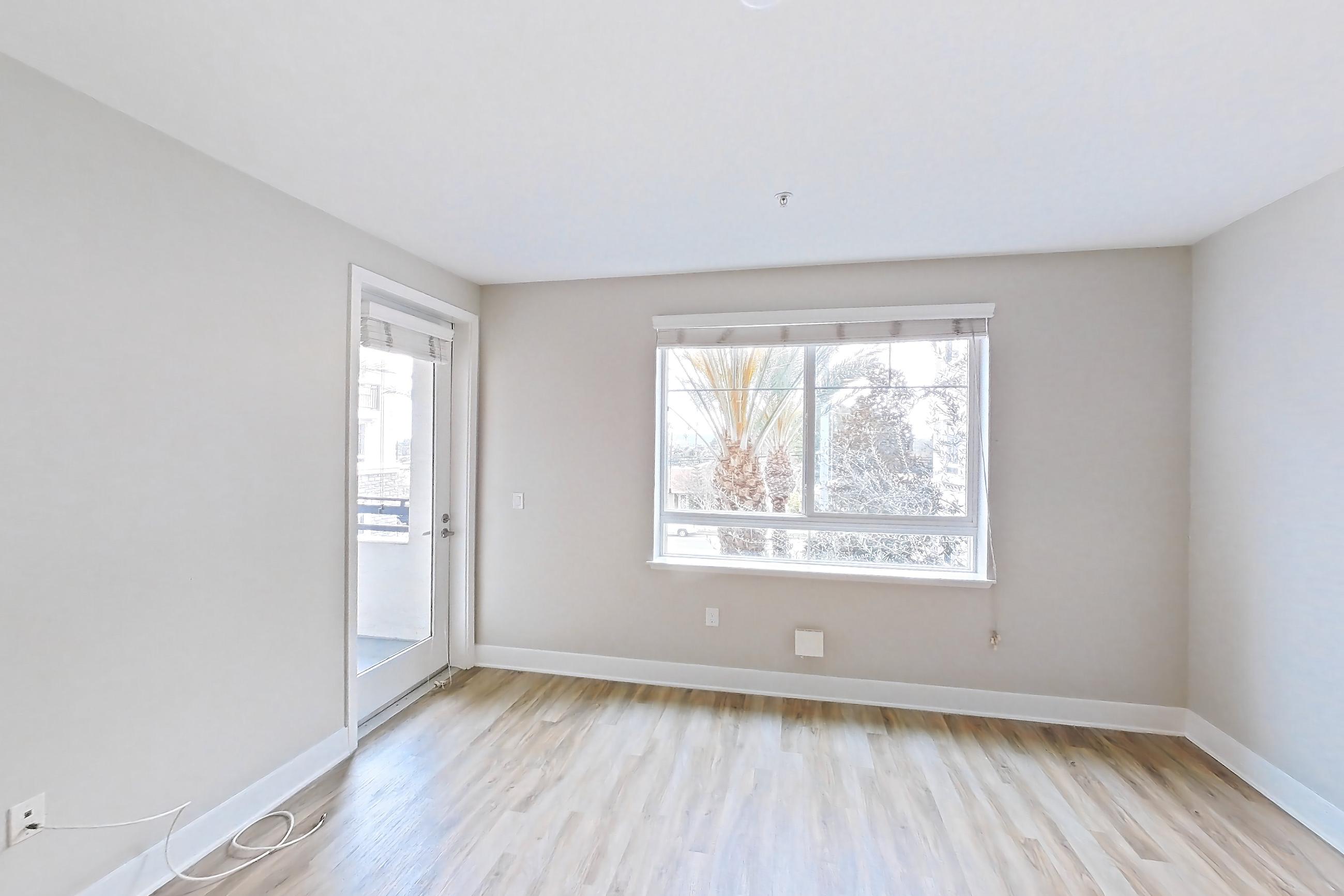Living room with light wood-finish flooring, Apartment 0-3051 at Alder