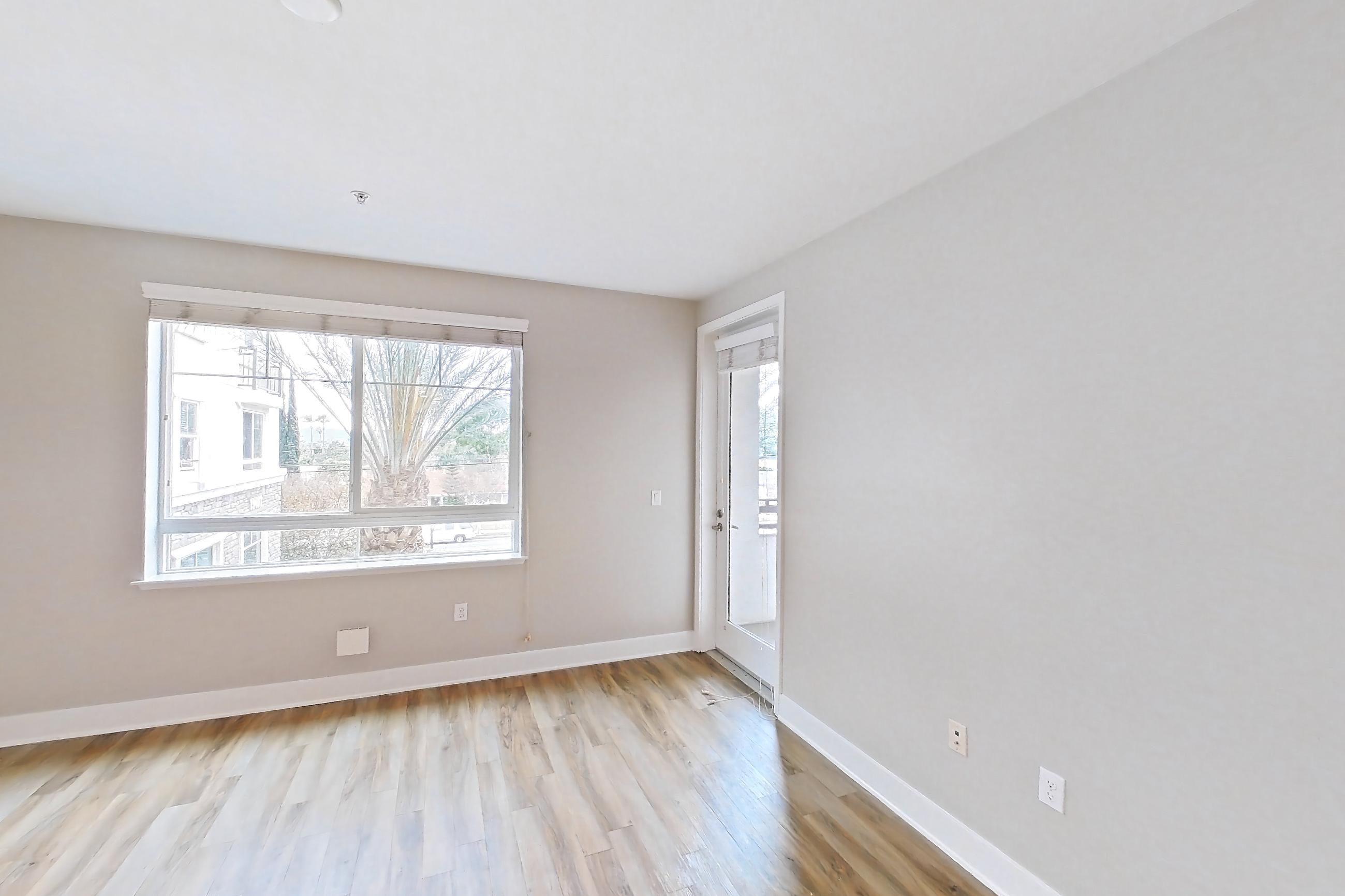 Living room with light wood-finish flooring and wood-finish flooring, Apartment 0-3052 at Alder