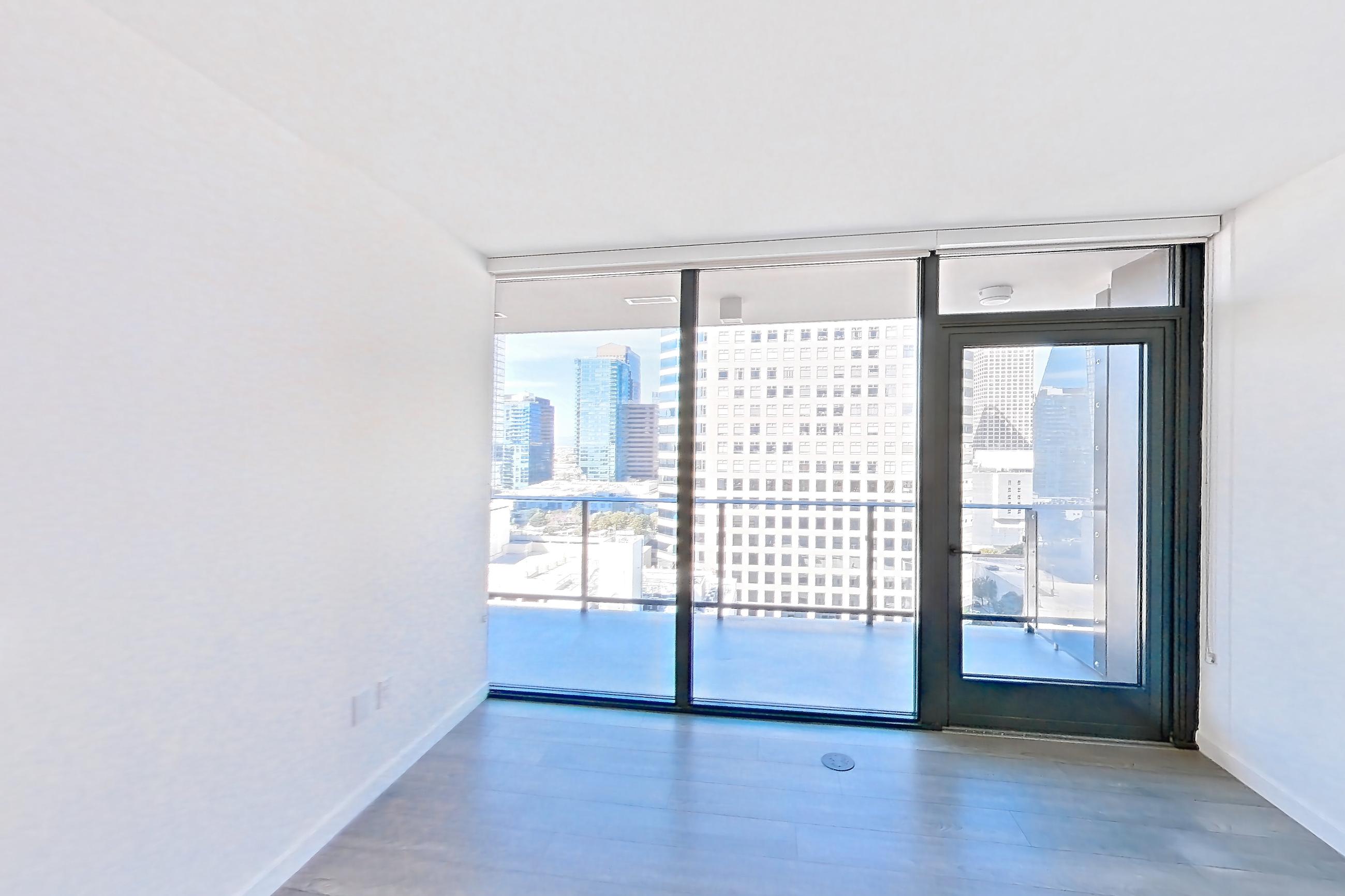 Living room with city view, dark wood-finish flooring, light stone countertops, and light wood-finish flooring, Apartment 1712 at Atelier