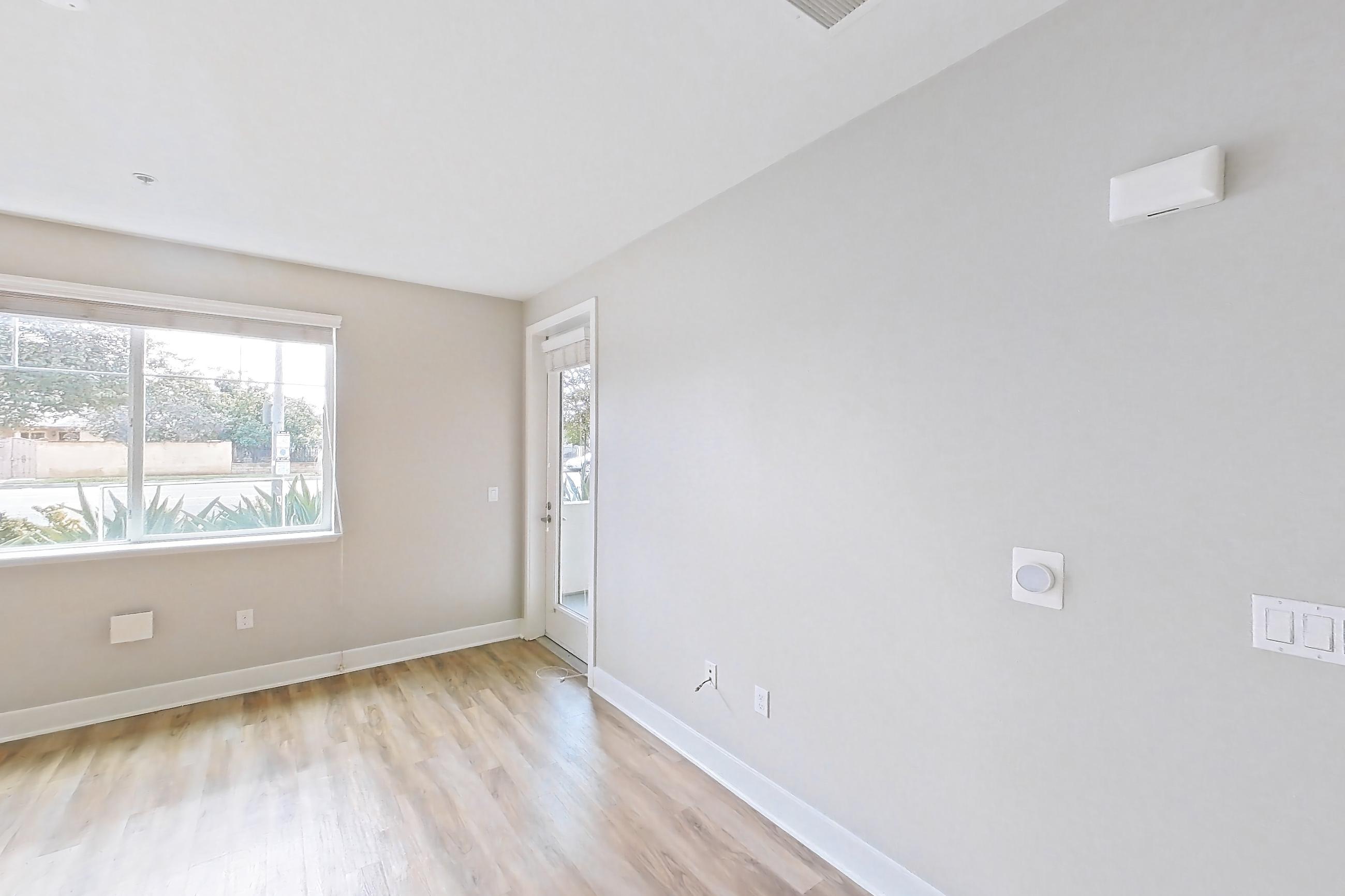Living room with light wood-finish flooring, Apartment 0-1021 at Alder