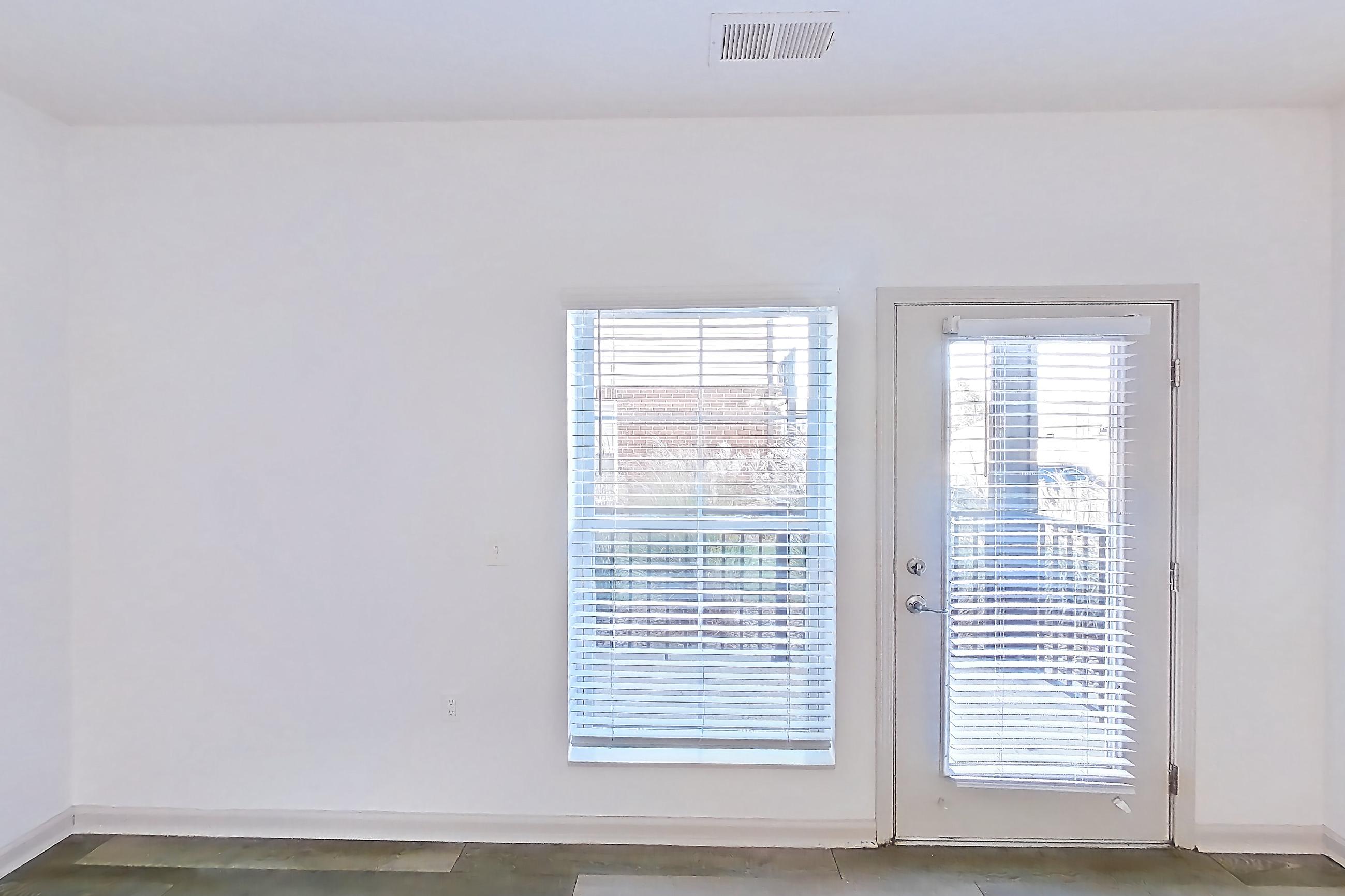 Living room with light wood-finish flooring, Apartment 108-4839 at Cortland Hilliard