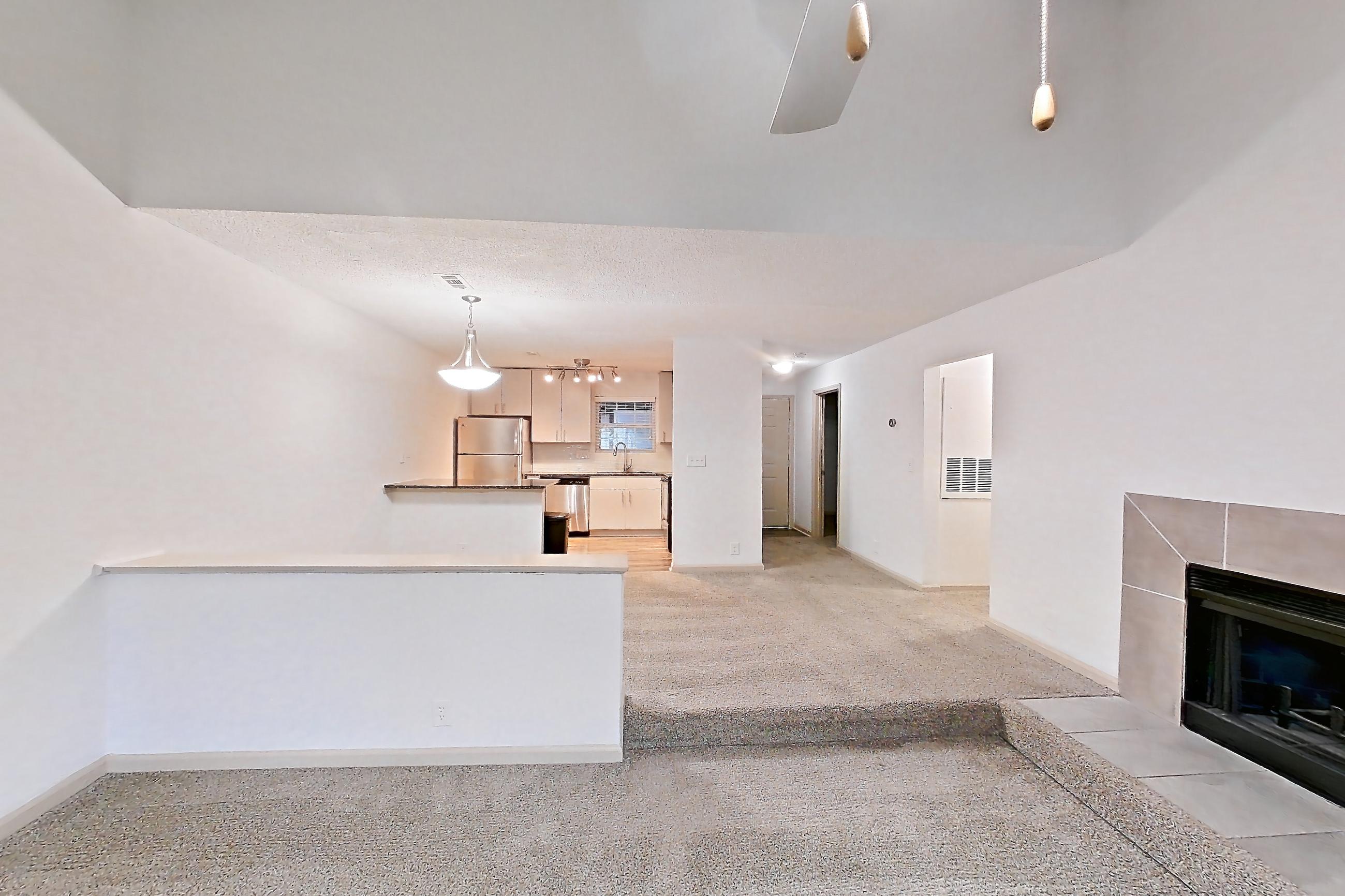 Living space with fireplace and tile fireplace, Apartment 12 at Cortland Cotswold
