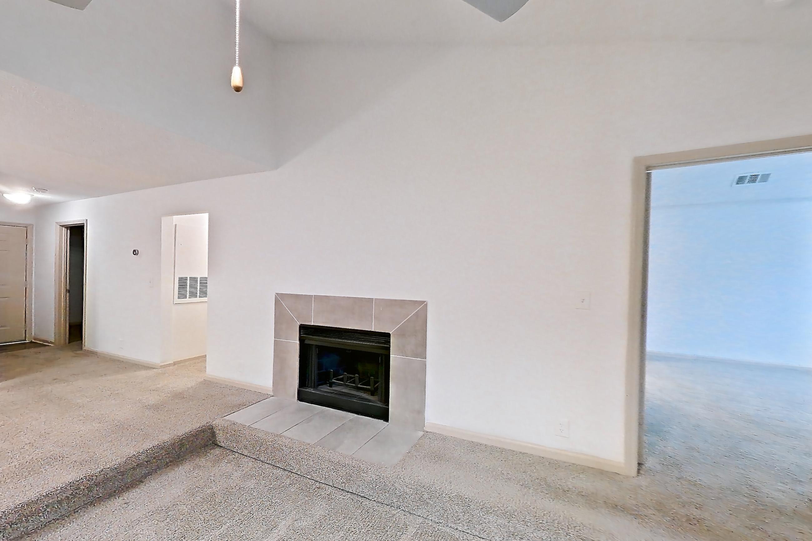 Living space with fireplace and tile fireplace, Apartment 12 at Cortland Cotswold
