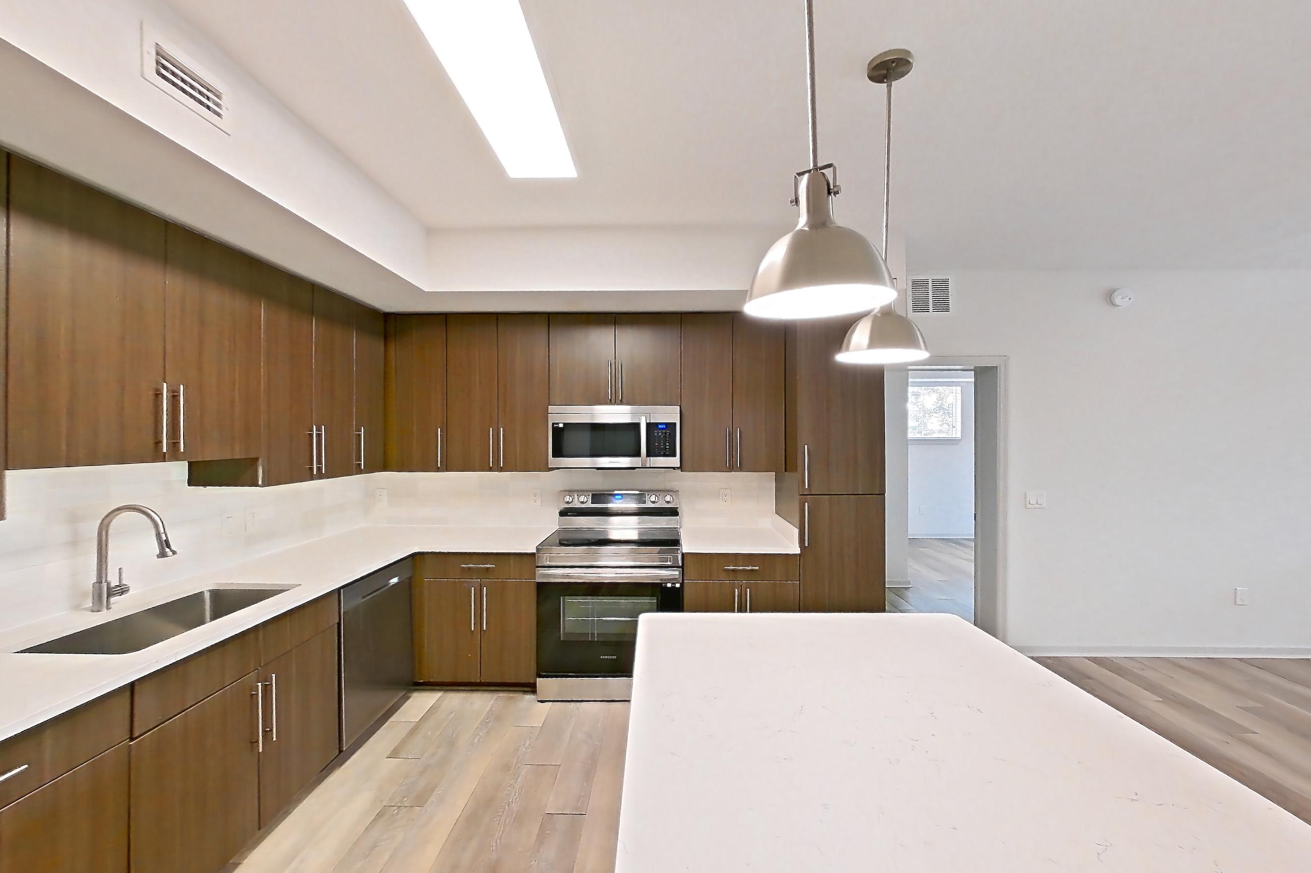 Kitchen entryway in Apartment 12-202 at Cortland West Palm, B1R - Flagler floor plan