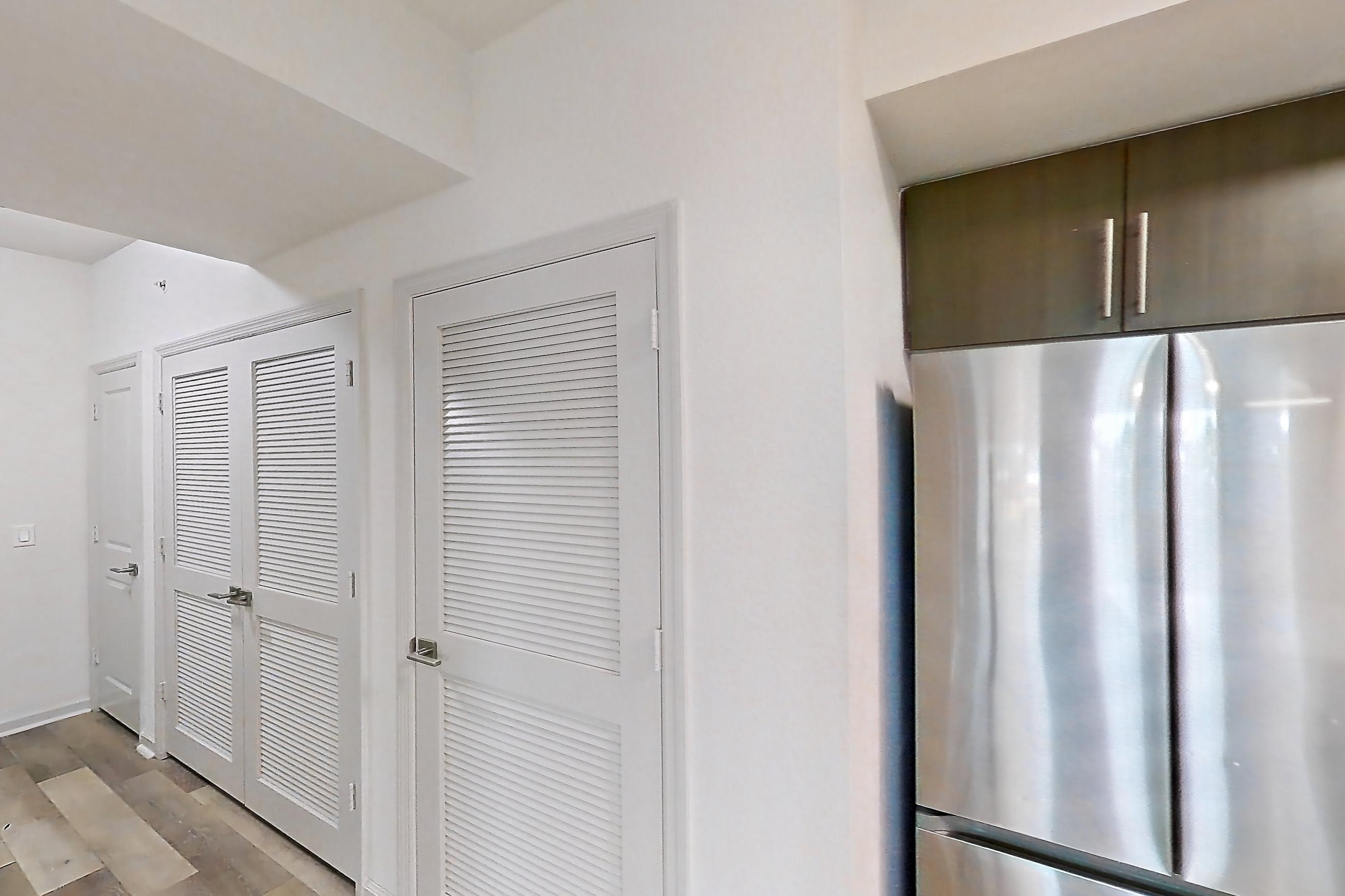 Kitchen entryway in Apartment 12-202 at Cortland West Palm, B1R - Flagler floor plan