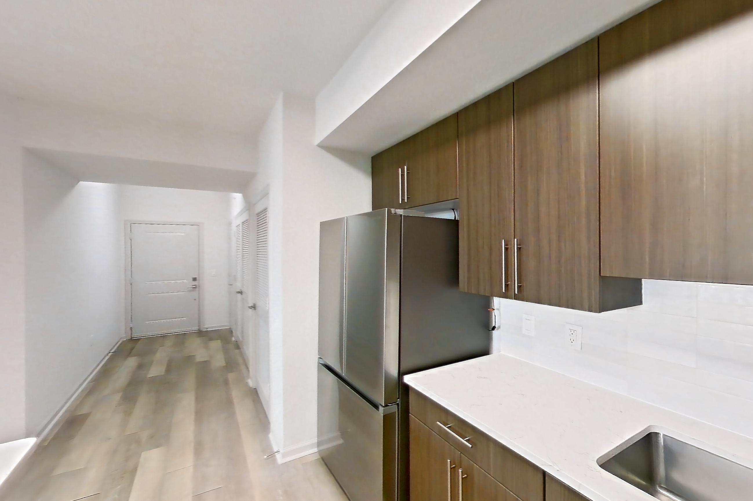 Kitchen in Apartment 12-202 at Cortland West Palm, B1R - Flagler floor plan