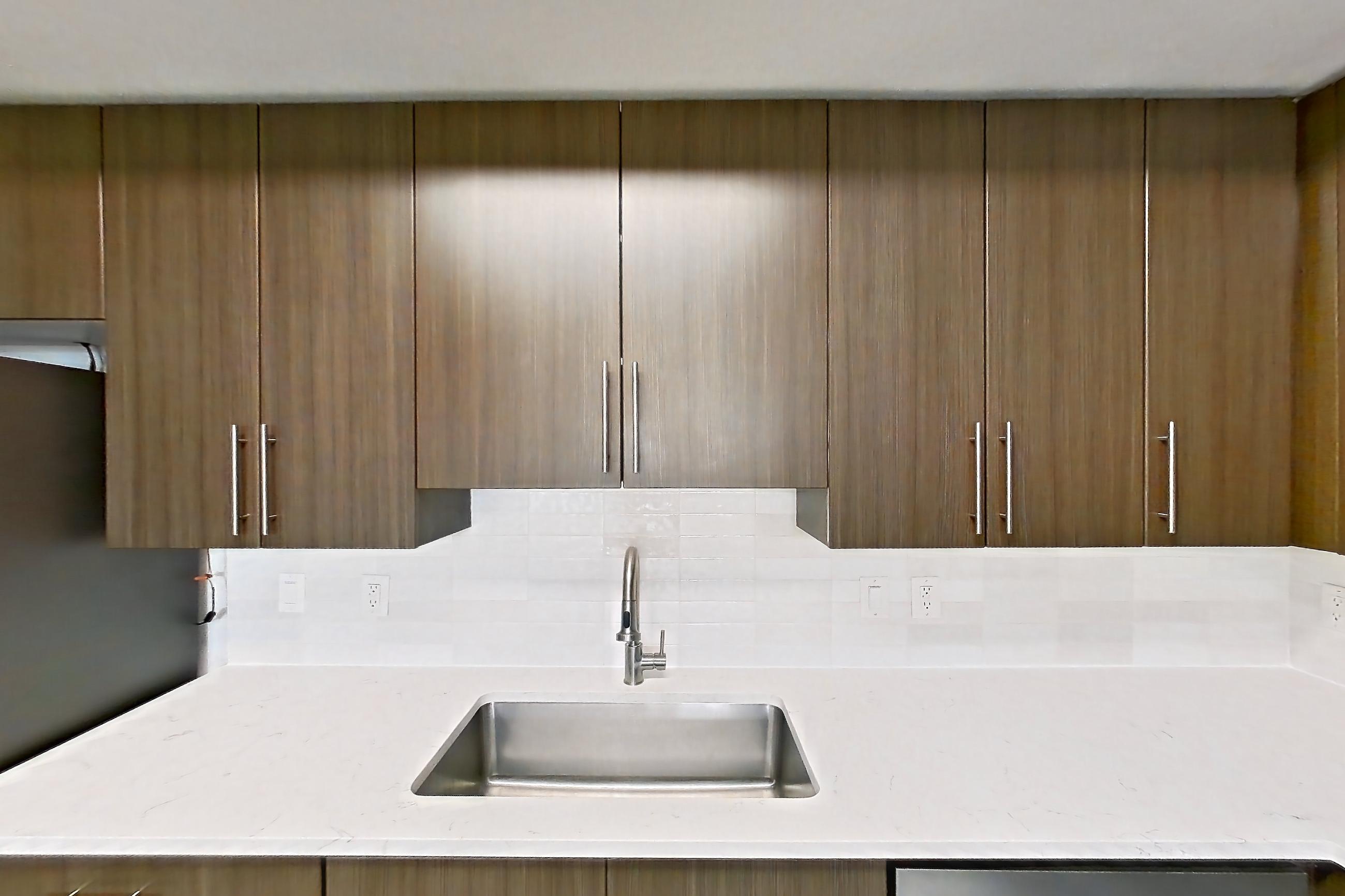 Kitchen in Apartment 12-202 at Cortland West Palm, B1R - Flagler floor plan