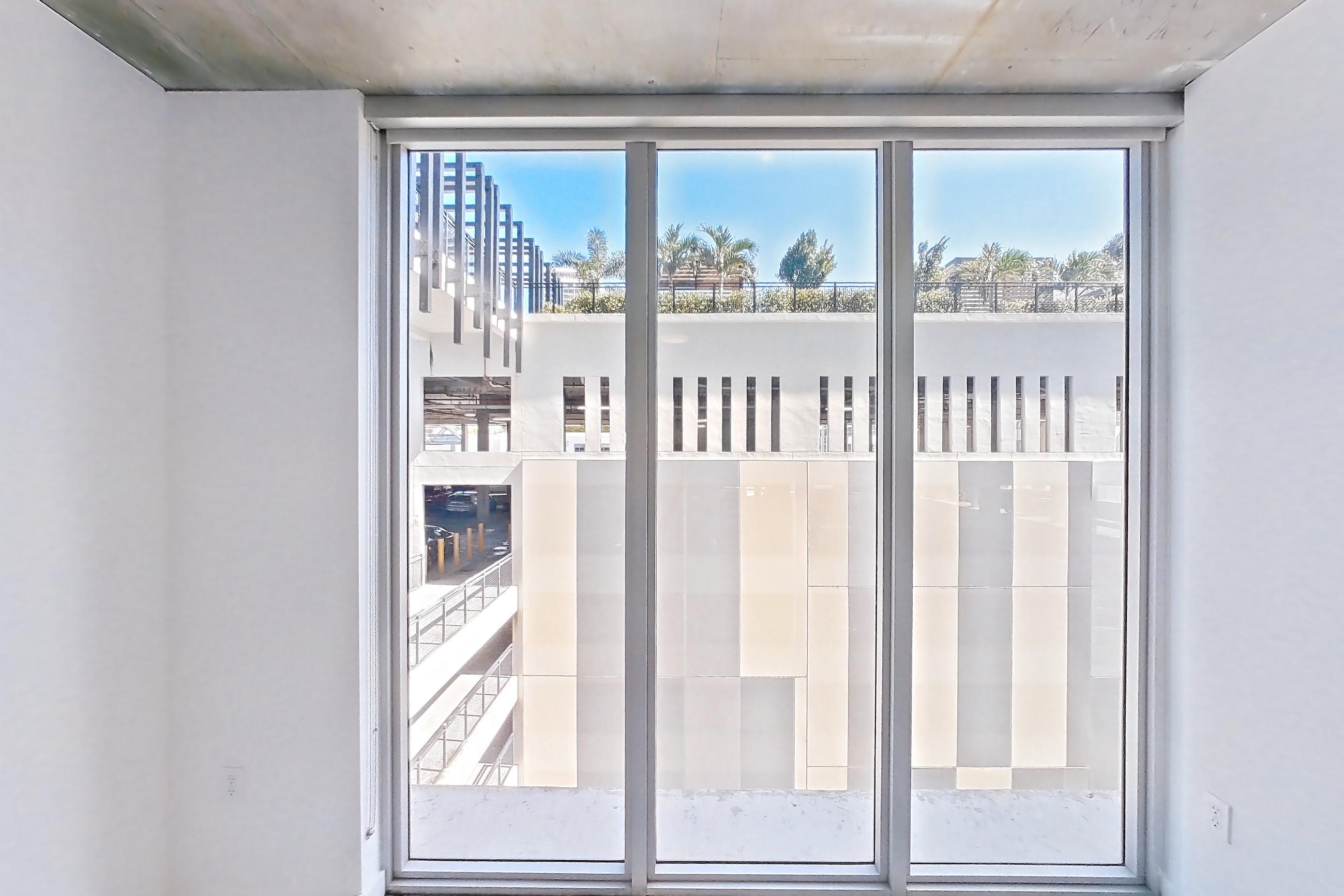 Living space with wood-look tile flooring, Apartment 0907 at Cortland Midtown Miami