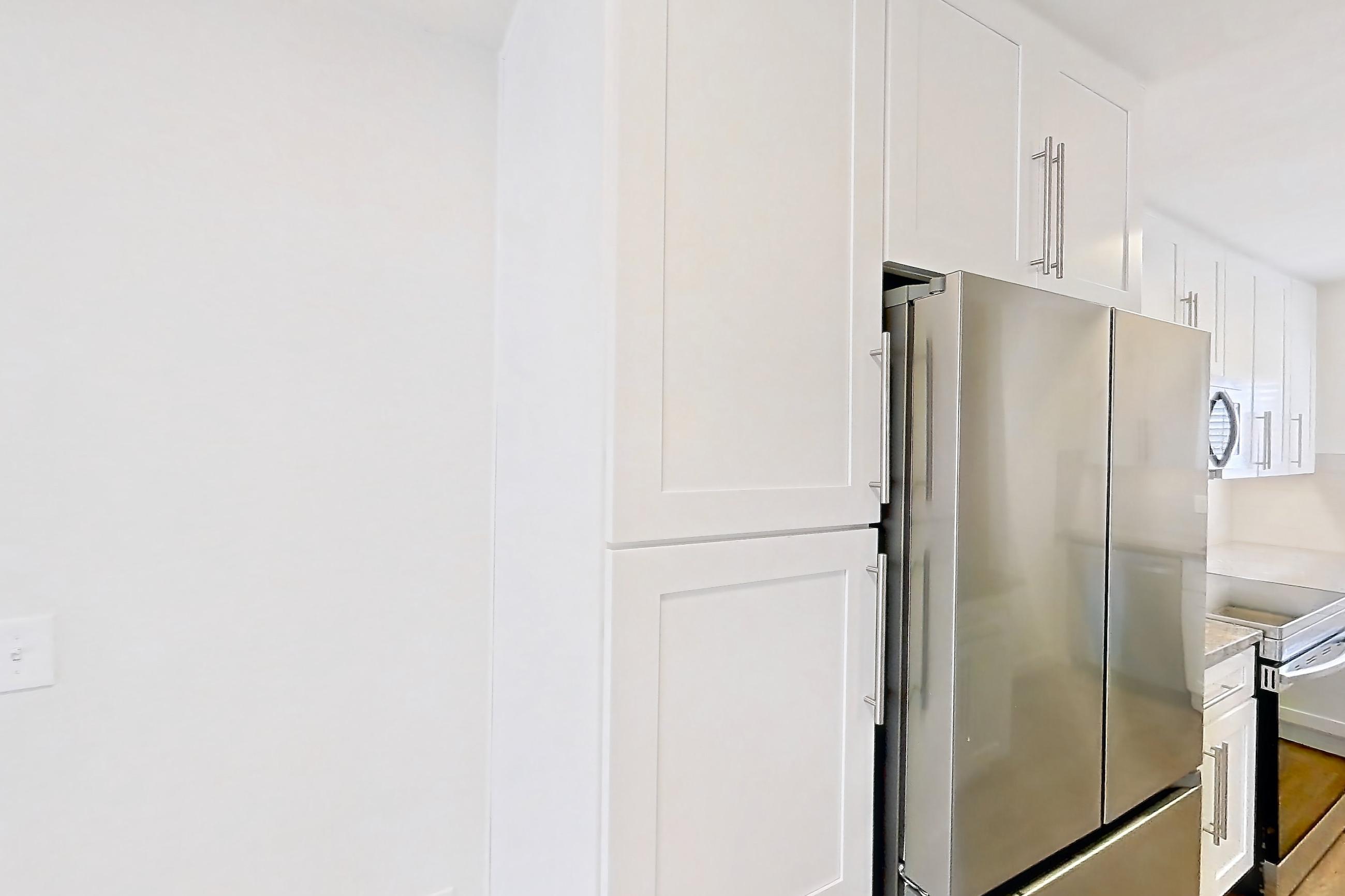 Dining room with dishwasher, light countertops, light wood-finish flooring, and stainless steel appliances, Apartment 19289 at Cortland Sabino Canyon