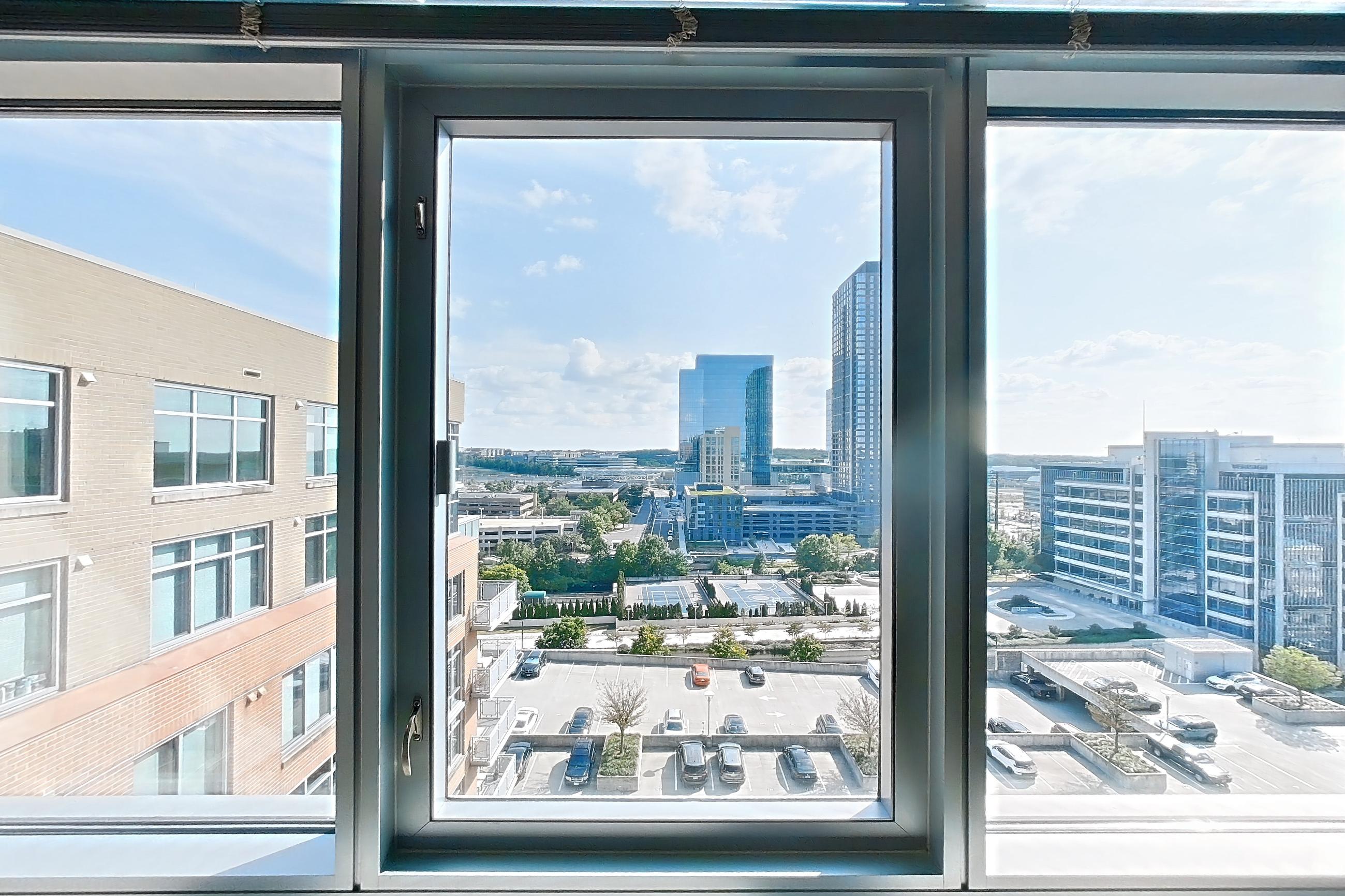 Living room 2 with city view, Apartment 1315 at The Avant at Reston Town Center