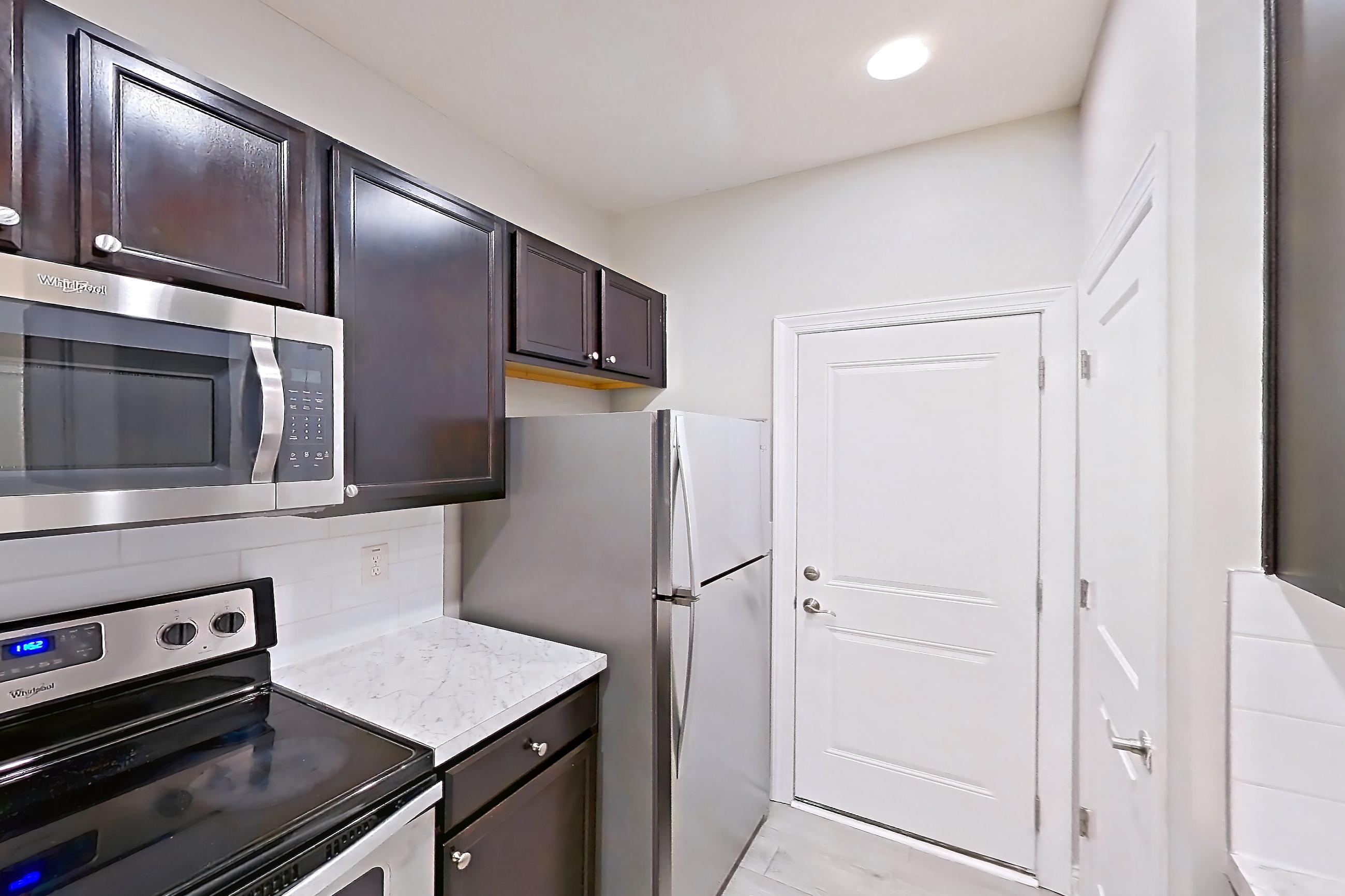 Kitchen in Apartment h9045 at Cortland Powell, B2R - Summit floor plan