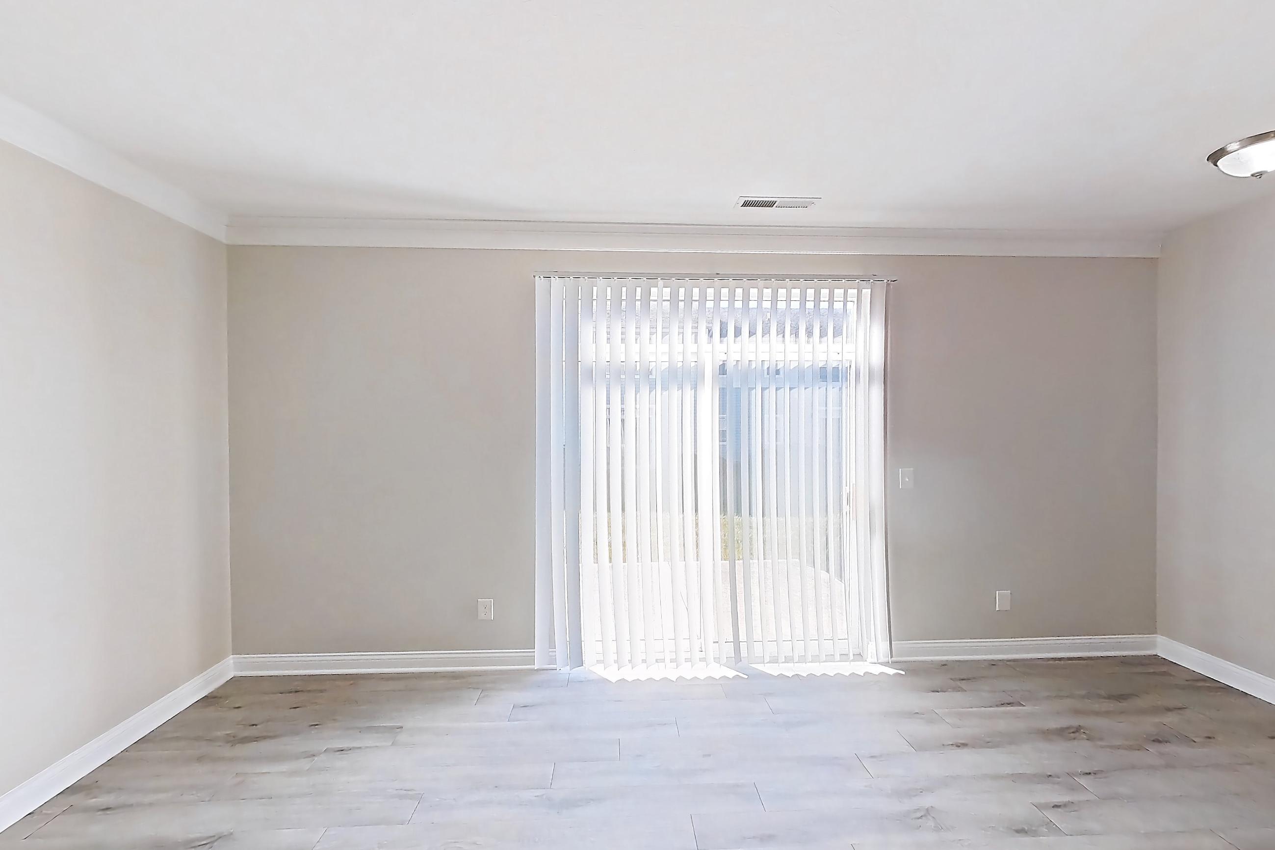 Living room with light wood-finish flooring, Apartment M3271 at Cortland Powell