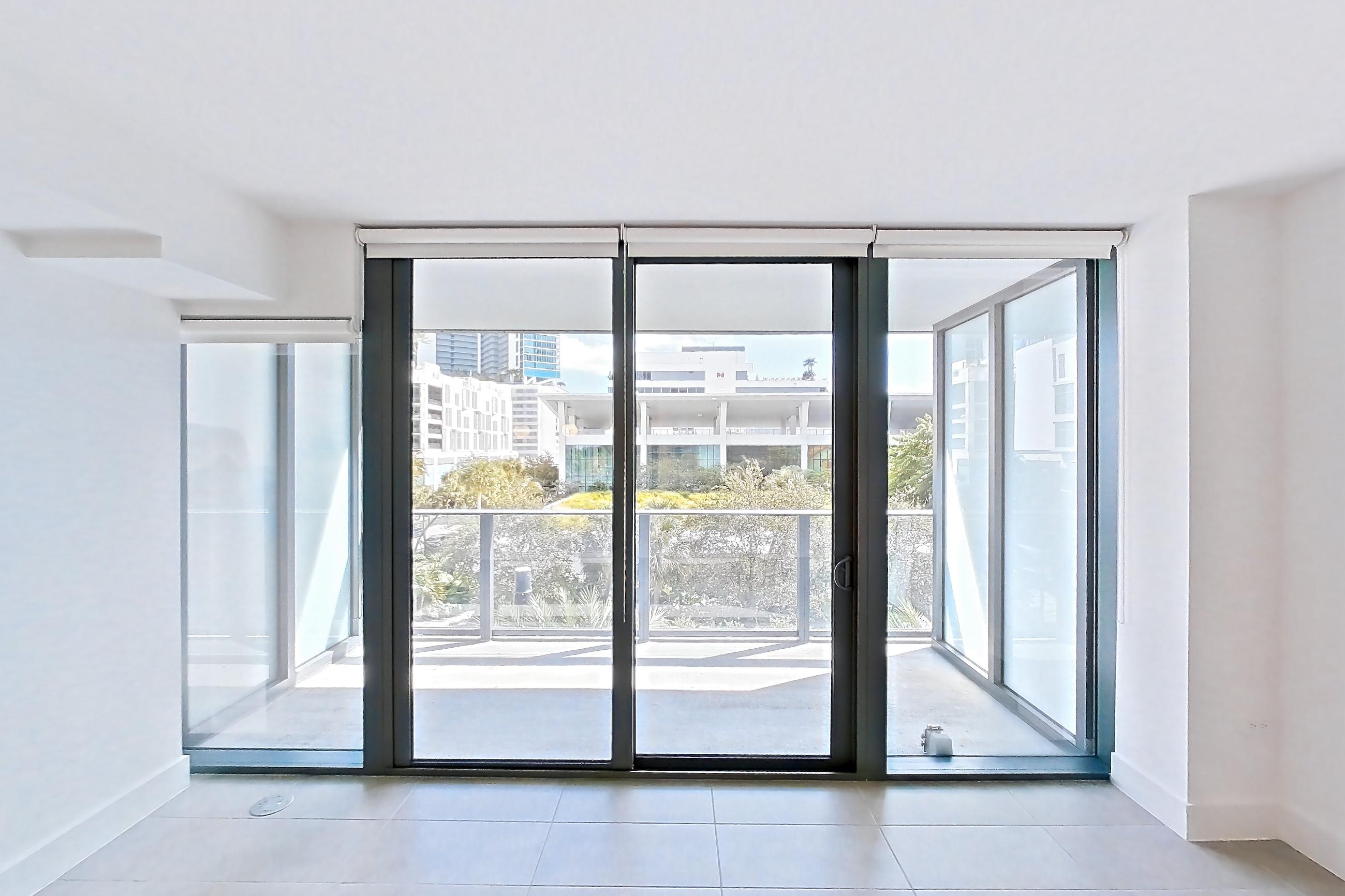 Living space with light tile flooring, Apartment 0508 at Miami World Tower