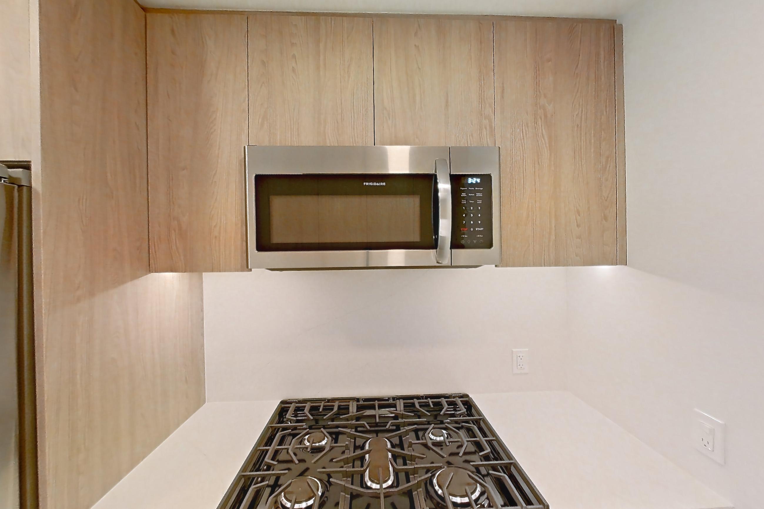Kitchen with gas range, oven/range, and stainless steel appliances, Apartment 0637 at Loden